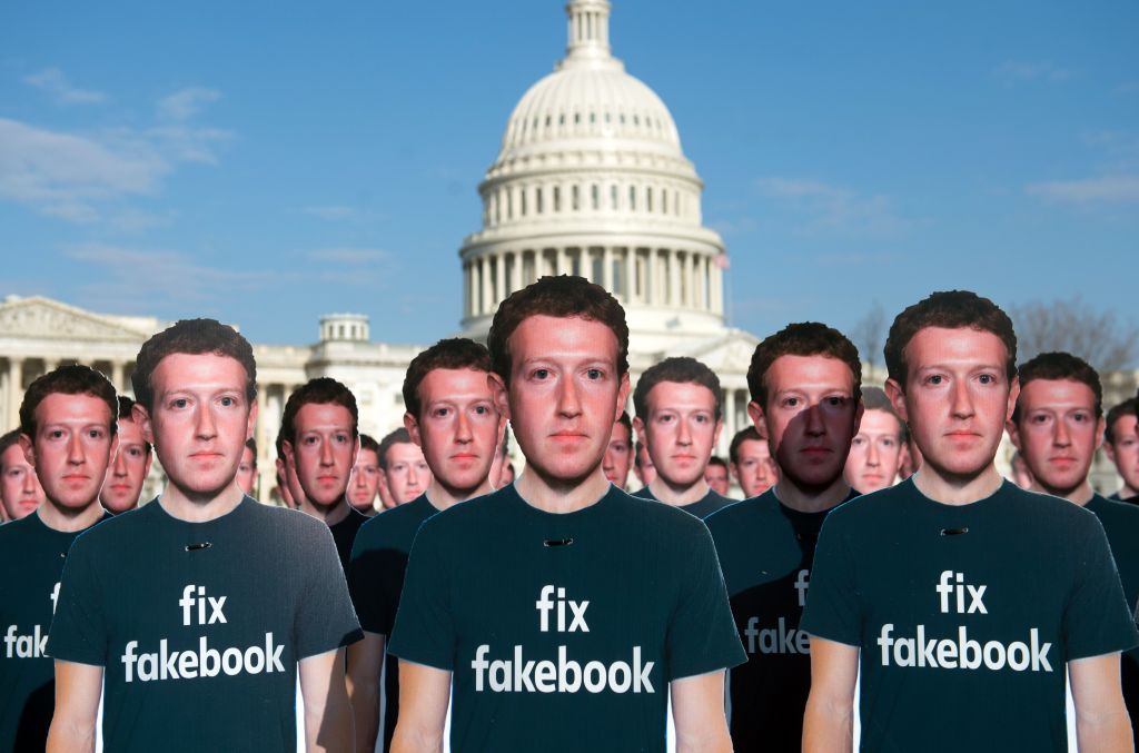 Cardboard cutouts of Facebook founder and CEO Mark Zuckerberg stand outside the US Capitol in Washington, DC, April 10, 2018. CREDIT: SAUL LOEB/AFP/Getty Images.