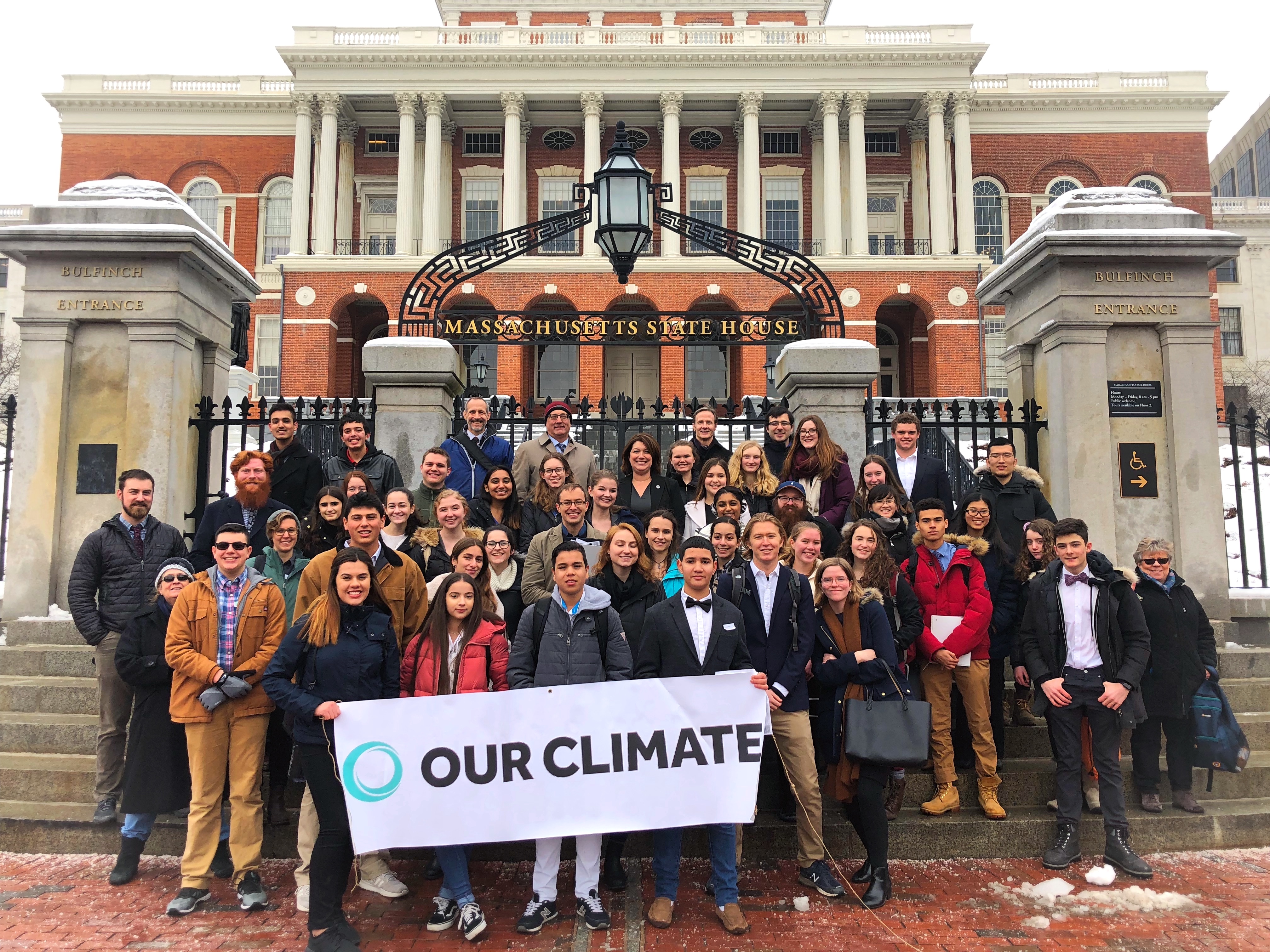 Our Climate leaders pose in front of the Massachusetts State House with Rep. Jen Benson (D-MA). CREDIT: Our Climate