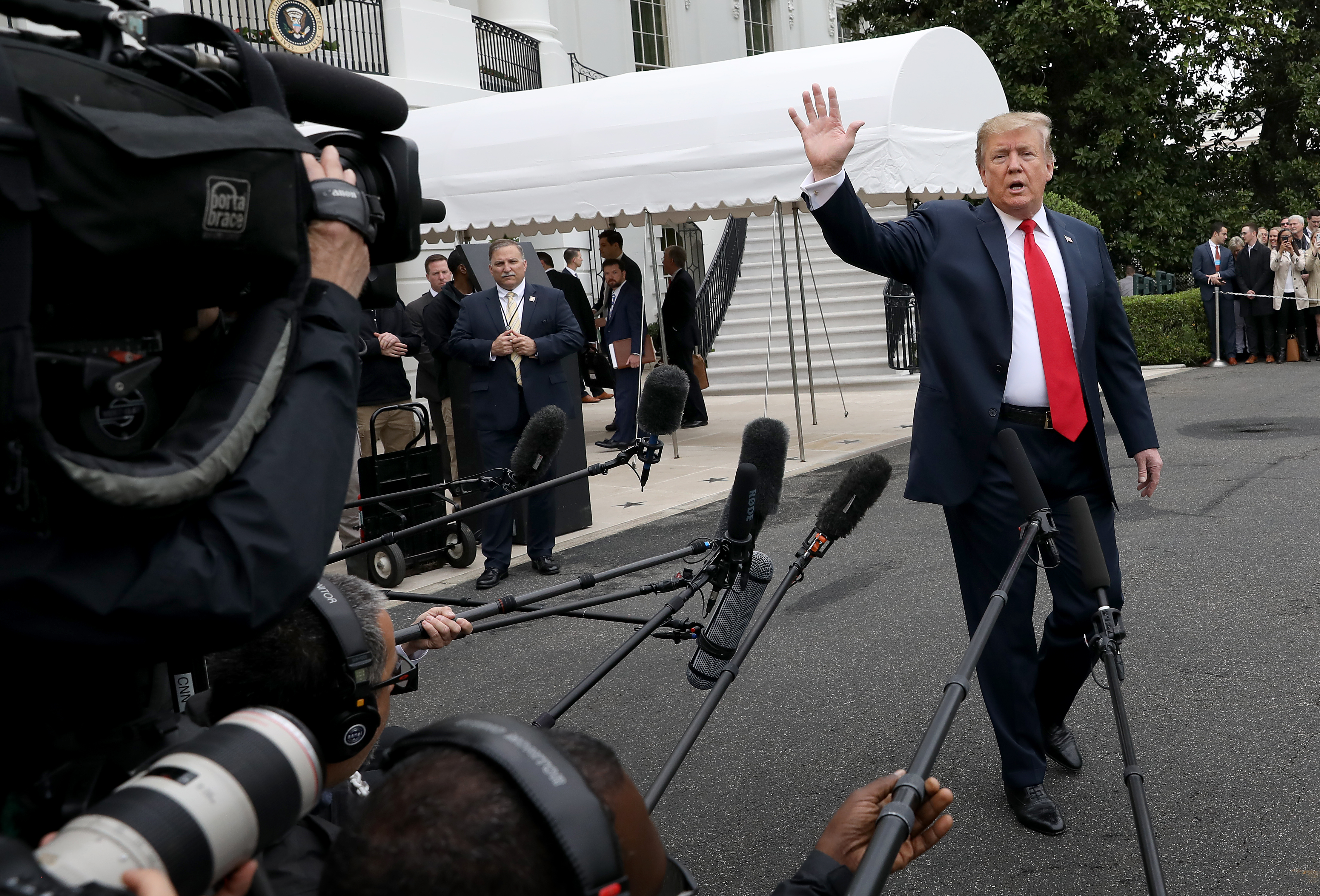 President Donald Trump waves goodbye after answering questions while departing the White House April 26, 2019 in Washington, DC. (Photo by Win McNamee/Getty Images)