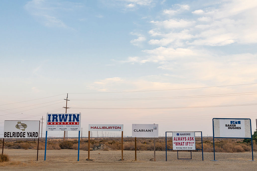 Company signs at Belridge Oil Field and hydraulic fracking site which is the fourth largest oil field in California. Kern County, San Joaquin Valley, California. (Credit: Citizens of the Planet/Education Images/UIG via Getty Images)