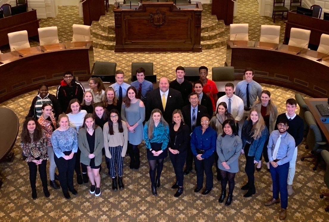 Our Climate Attleboro High School students on the Senate floor after convincing Senator Paul Feeney (D-MA) to cosponsor their carbon pricing bill. CREDIT: Our Climate