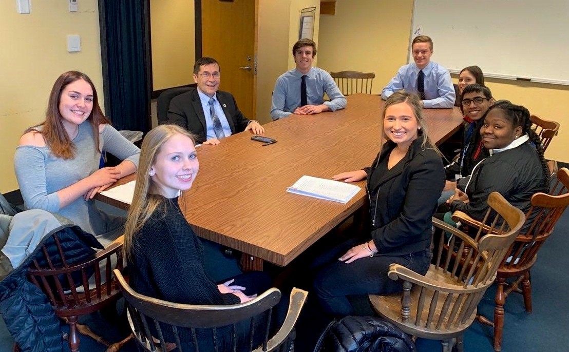 Our Climate Attleboro High School students sit down with Rep. Jim Hawkins (D-MA) to win his cosponsorship for their carbon pricing bill. CREDIT: Our Climate