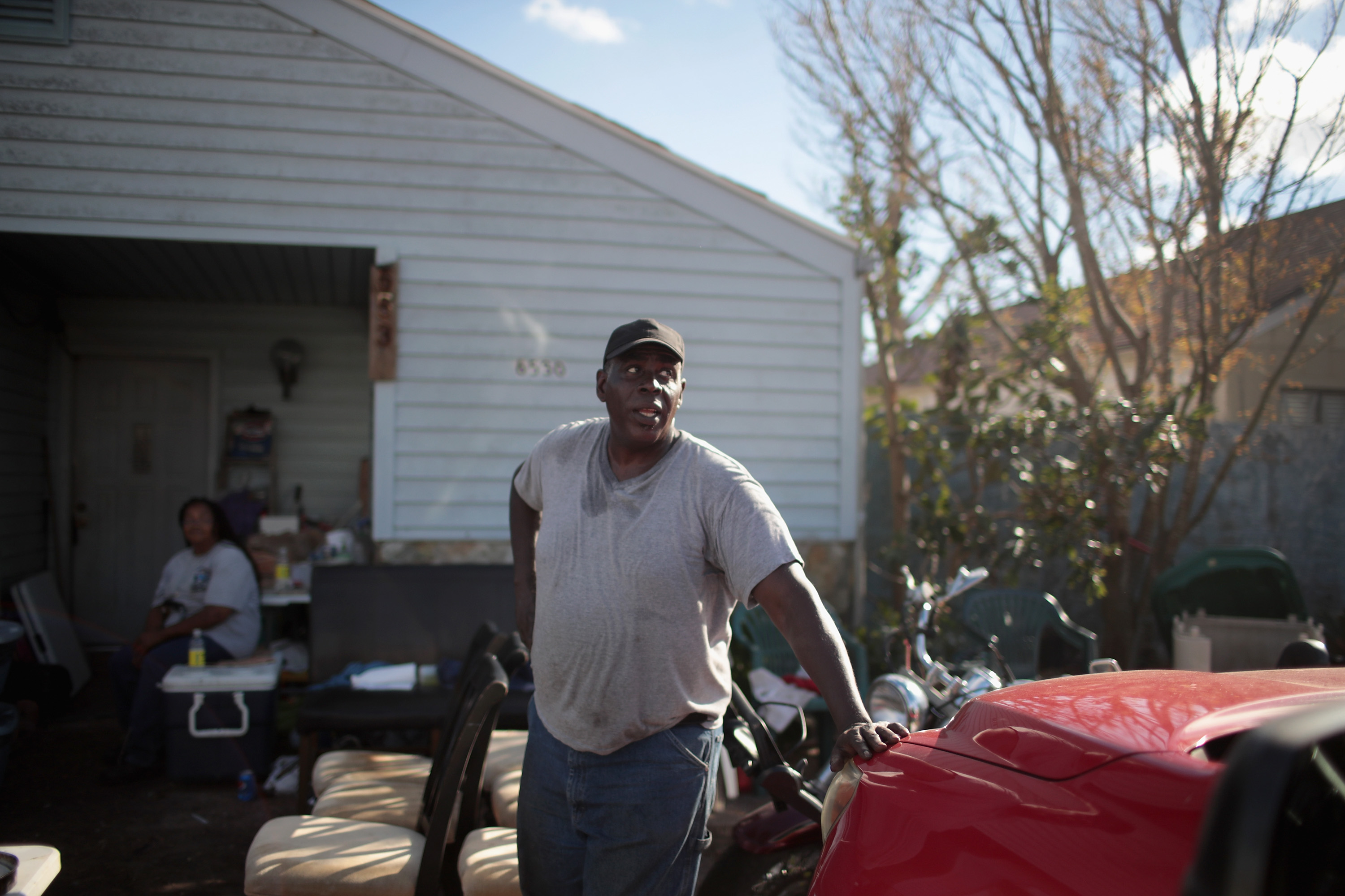 Vince Wicks helps to prepare a meal for friends and neighbors outside of a home which was severely damaged by Hurricane Michael on October 20, 2018 in Panama City, Florida. CREDIT: Scott Olson/Getty Images