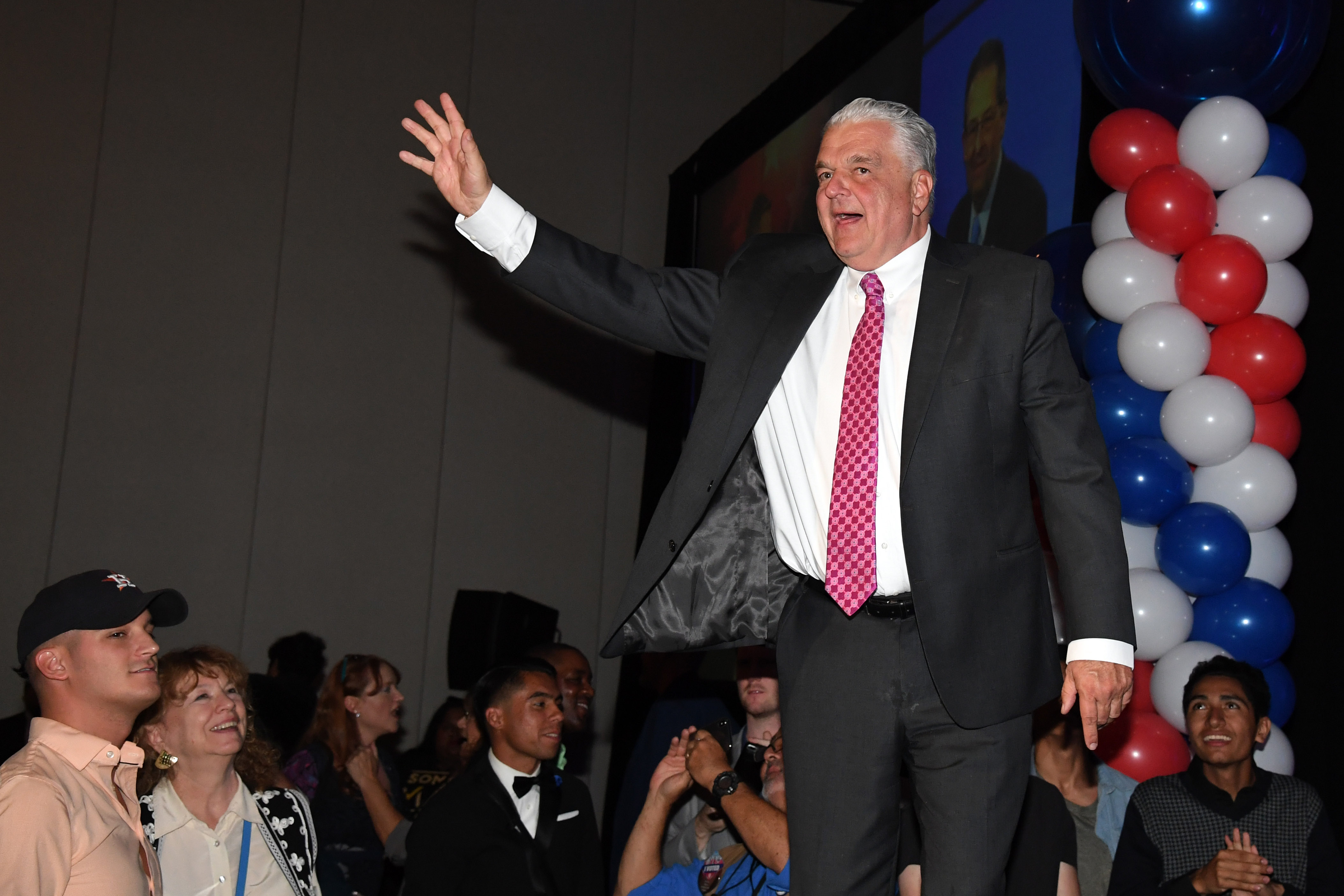 LAS VEGAS, NEVADA - NOVEMBER 07: Clark County Commission Chairman and Democratic gubernatorial candidate Steve Sisolak waves to supporters after winning his race against Nevada Attorney General and Republican gubernatorial candidate Adam Laxalt at the Nevada Democratic Party's election results watch party at Caesars Palace on November 7, 2018 in Las Vegas, Nevada. Americans voted on their choices of candidates in the midterm election, which is seen by many as a referendum on President Donald Trump. (Photo by Ethan Miller/Getty Images)