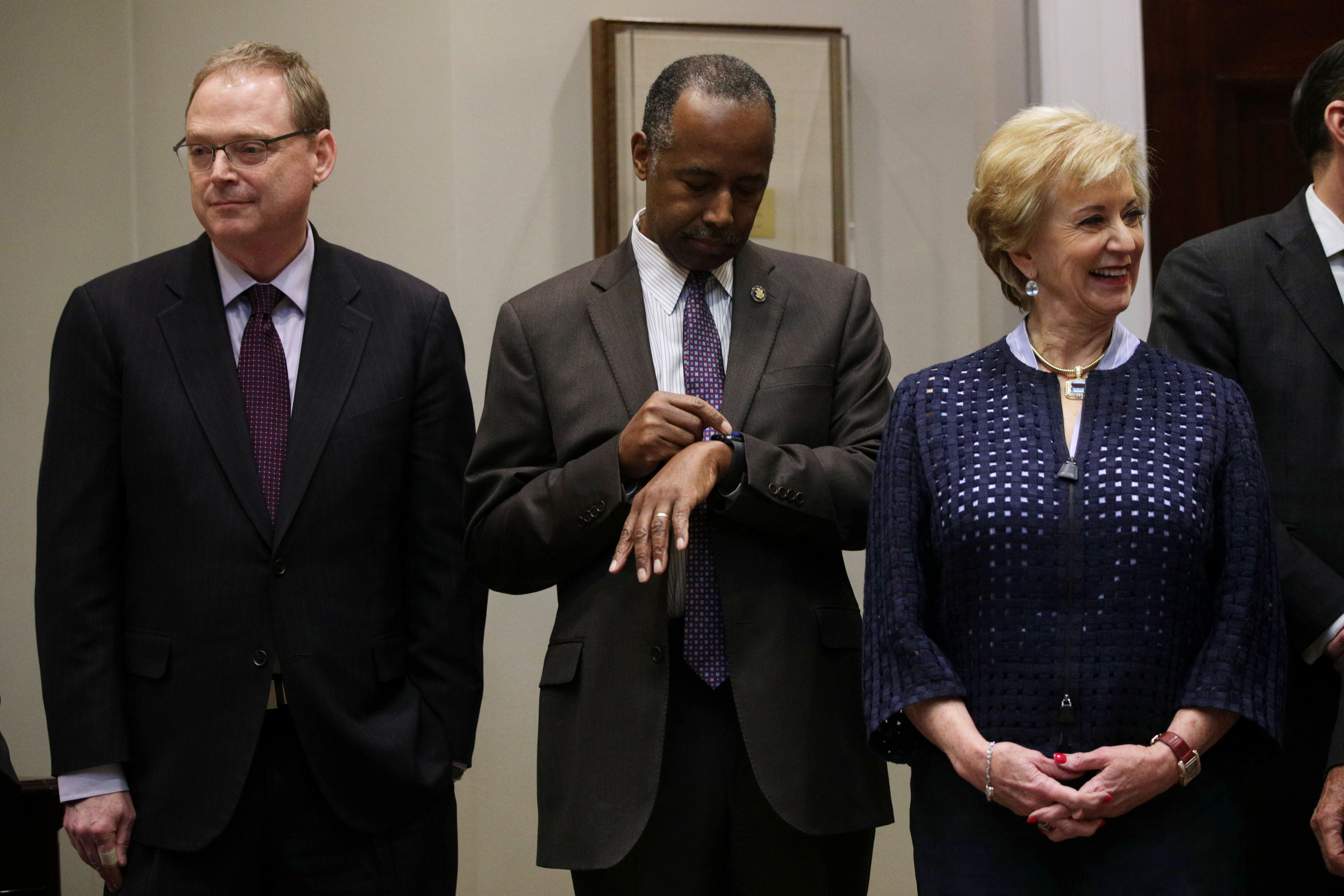 U.S. Housing and Urban Development Secretary Ben Carson looks at his watch during a February appearance at the White House. CREDIT: Alex Wong/Getty Images
