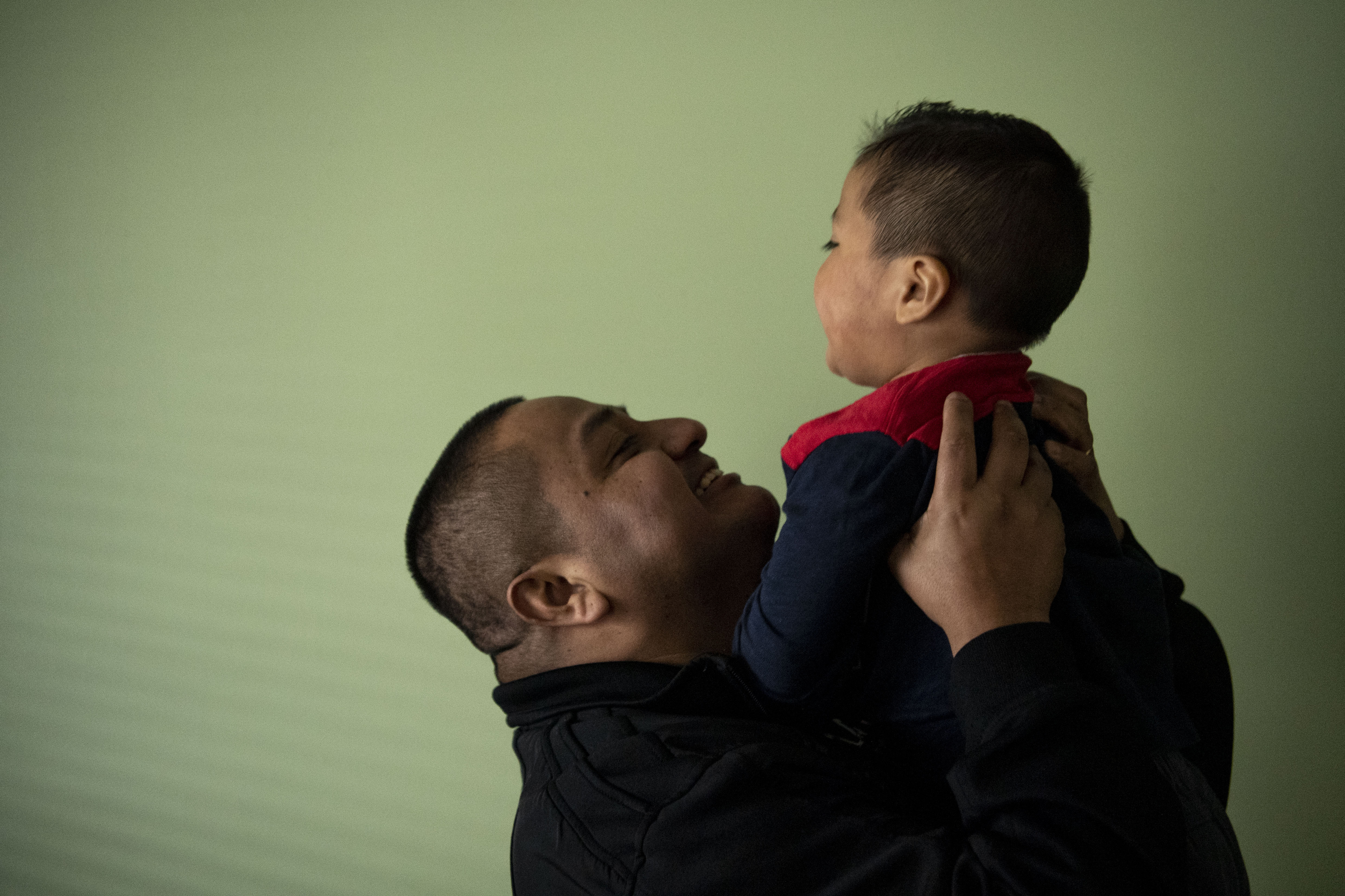 Juan Quintero lifts his son Liam Ortiz, 2, in the air in his home on February 25, 2019 in Poughkeepsie, NY. Juan Quintero, an undocumented immigrant from Mexico, worked at Trump National Golf Club Hudson Valley and then later for Eric Trump at Leather Hill Preserve, LLC, a property Eric Trump primarily uses for shooting. Quintero was fired along with dozens of other undocumented workers at Trump properties in New York and New Jersey. (Photo Credit: Carolyn Van Houten/The Washington Post via Getty Images)
