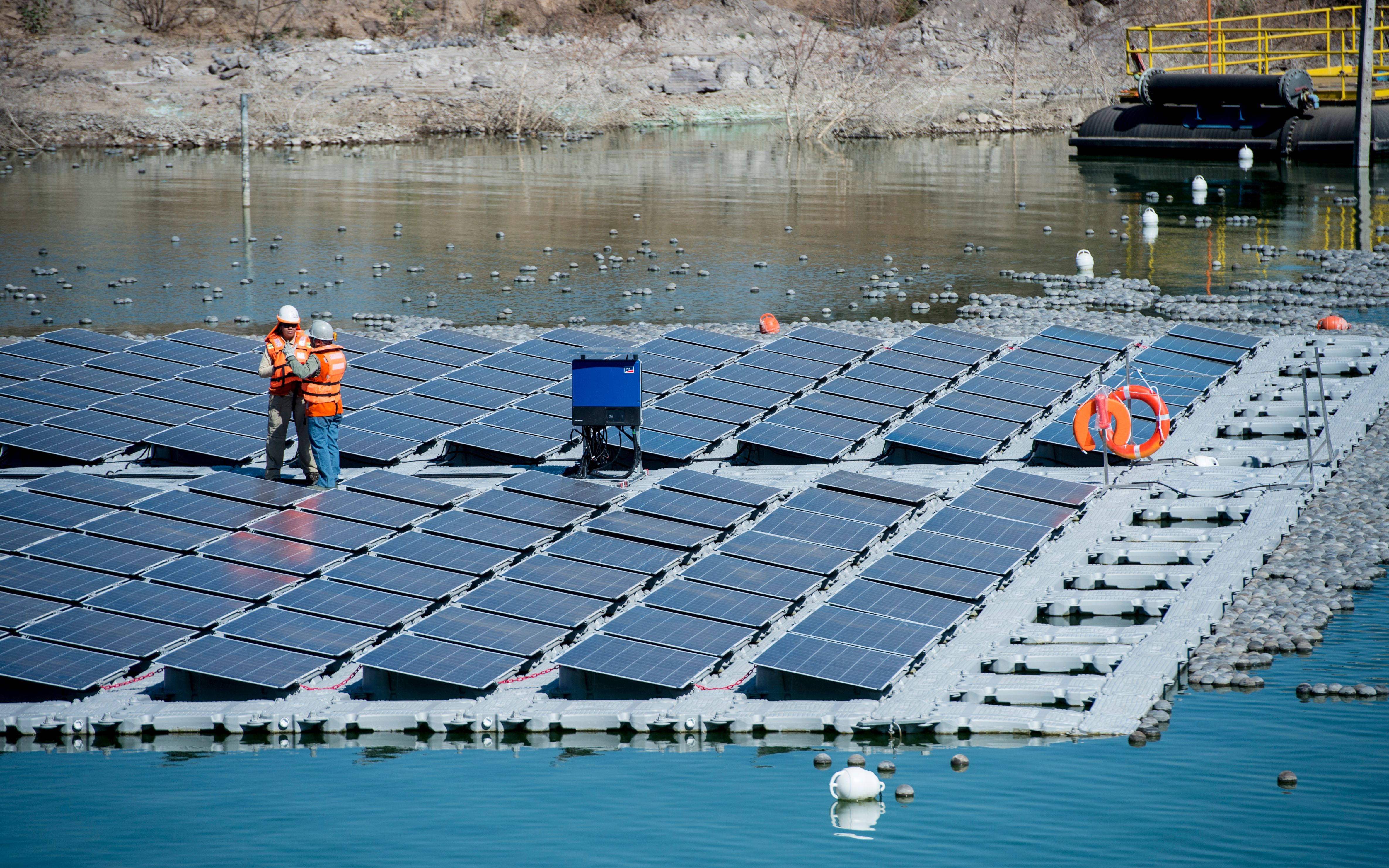 Floating solar panels. CREDIT: MARTIN BERNETTI/AFP/Getty Images