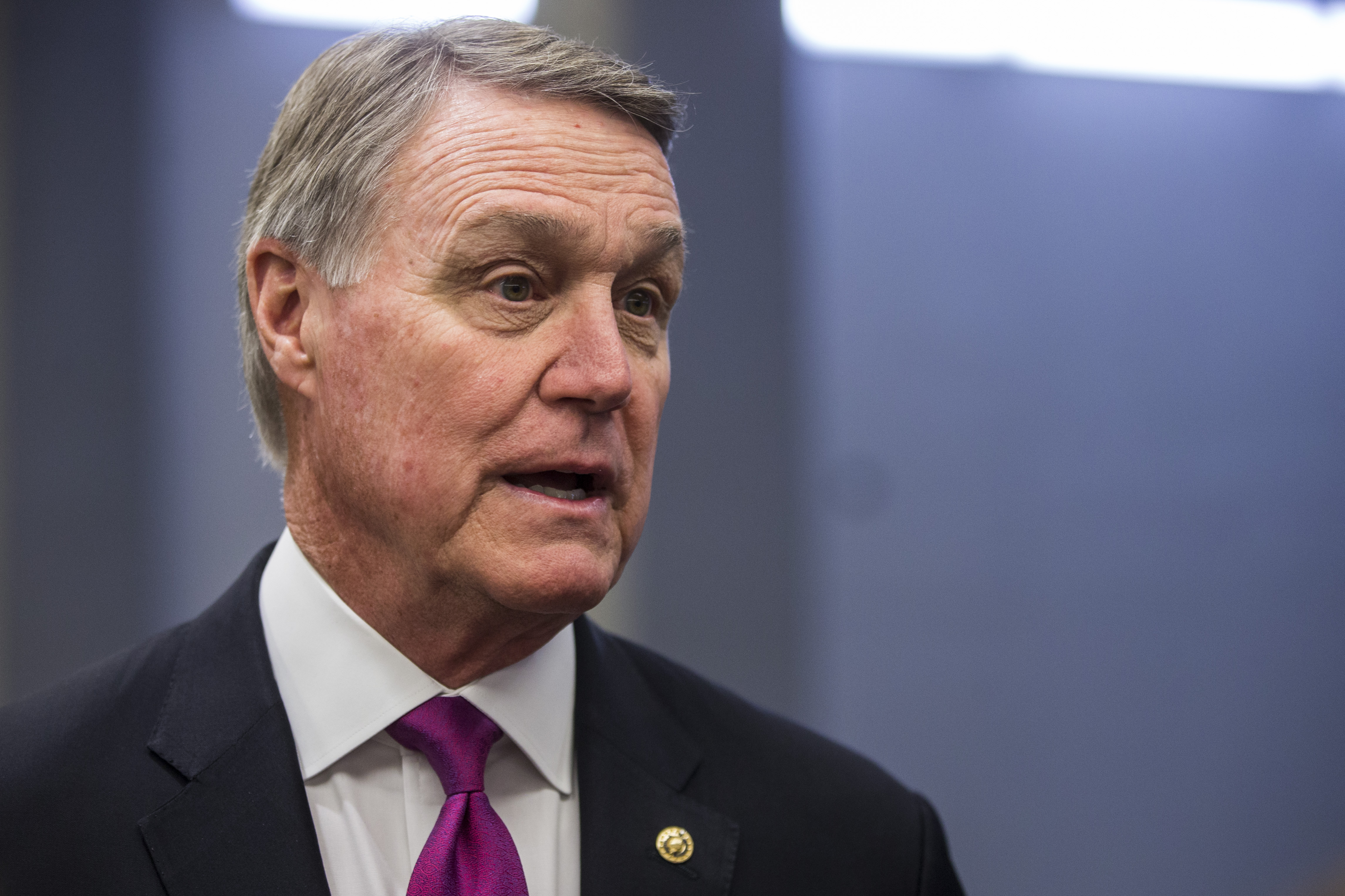 Sen. David Perdue (R-GA) speaks to reporters in the Senate Basement before a weekly policy luncheon on April 2, 2019 in Washington, DC. (Photo by Zach Gibson/Getty Images)