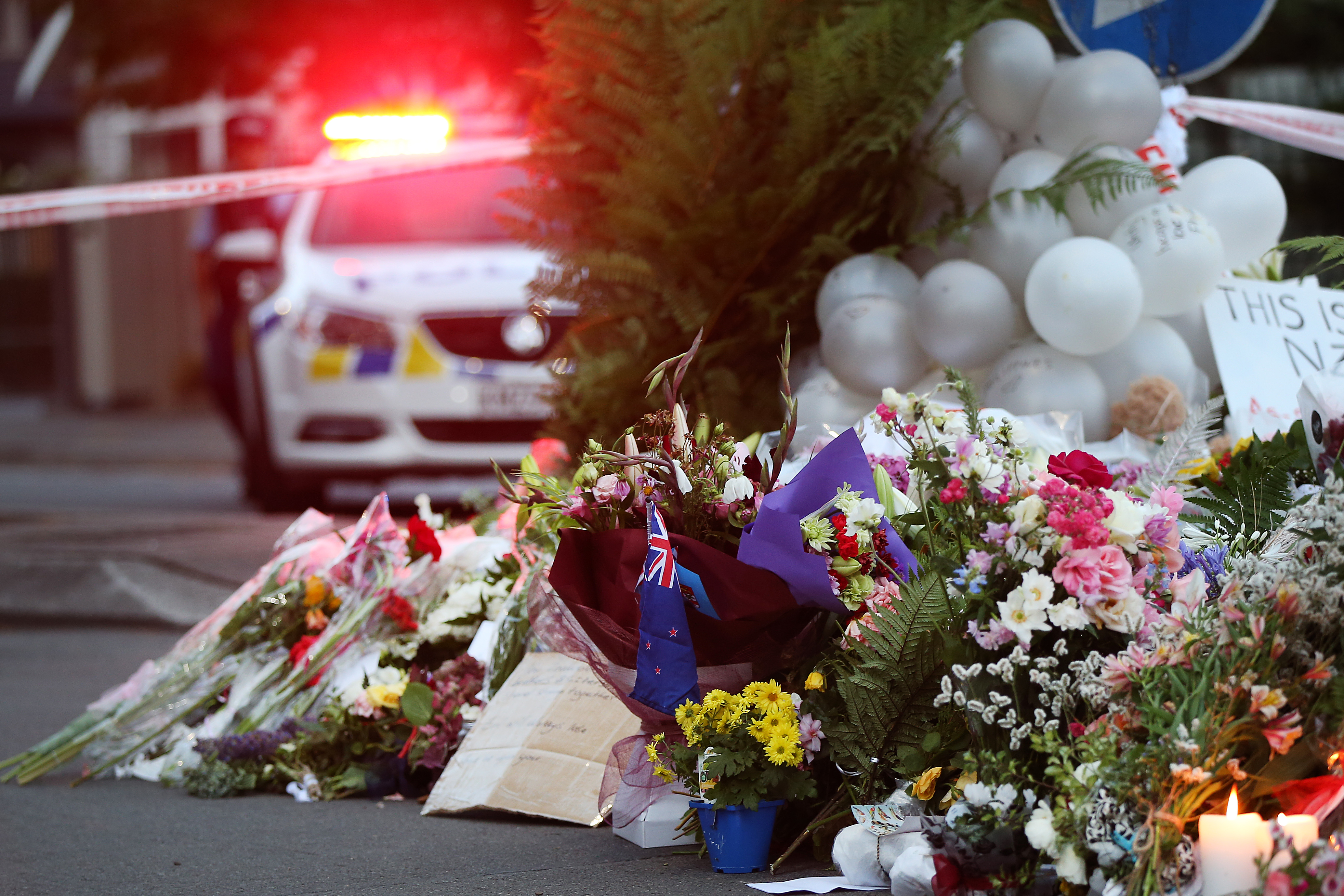 Flower are left at the Al Noor mosque March 17, 2019 in Christchurch, New Zealand. New Zealand media outlets have vowed not to promote the alleged Christchurch shooter's ideology during his upcoming trial. (Photo credit: Fiona Goodall/Getty Images)