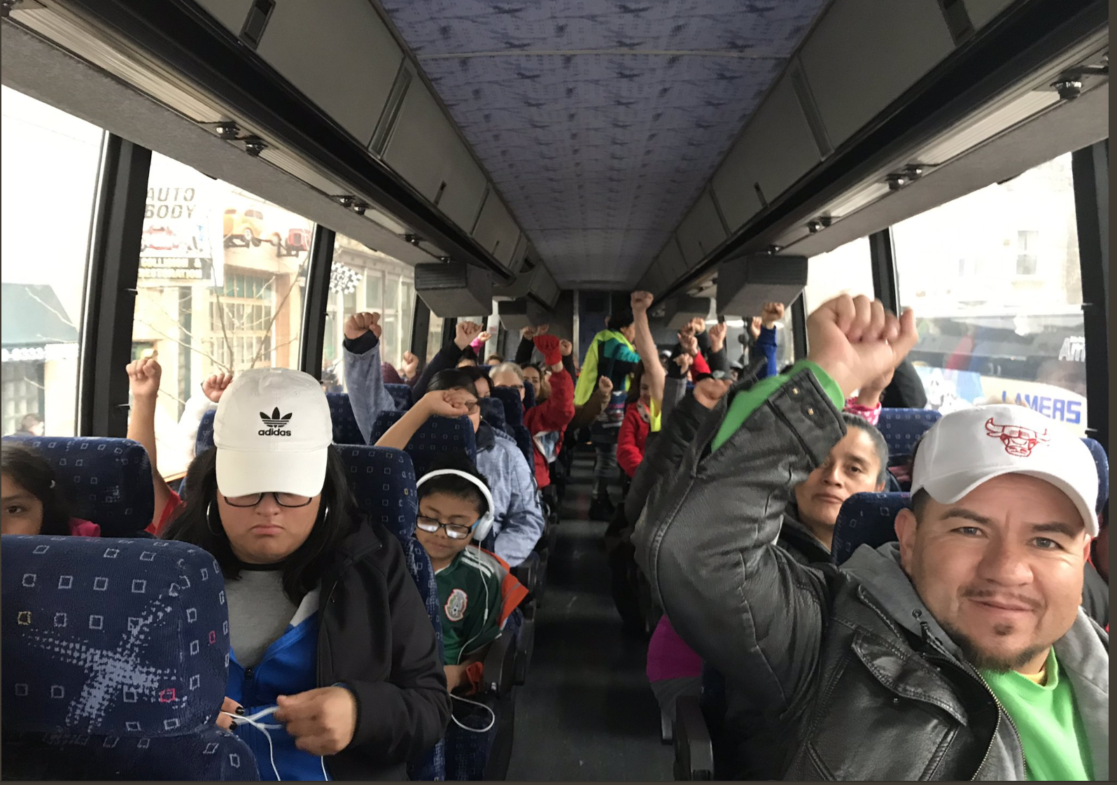 Protestors on a bus to Madison, WIsconsin in support of reinstating driver's licenses to undocumented immigrants (Credit: Voces de la Frontera)