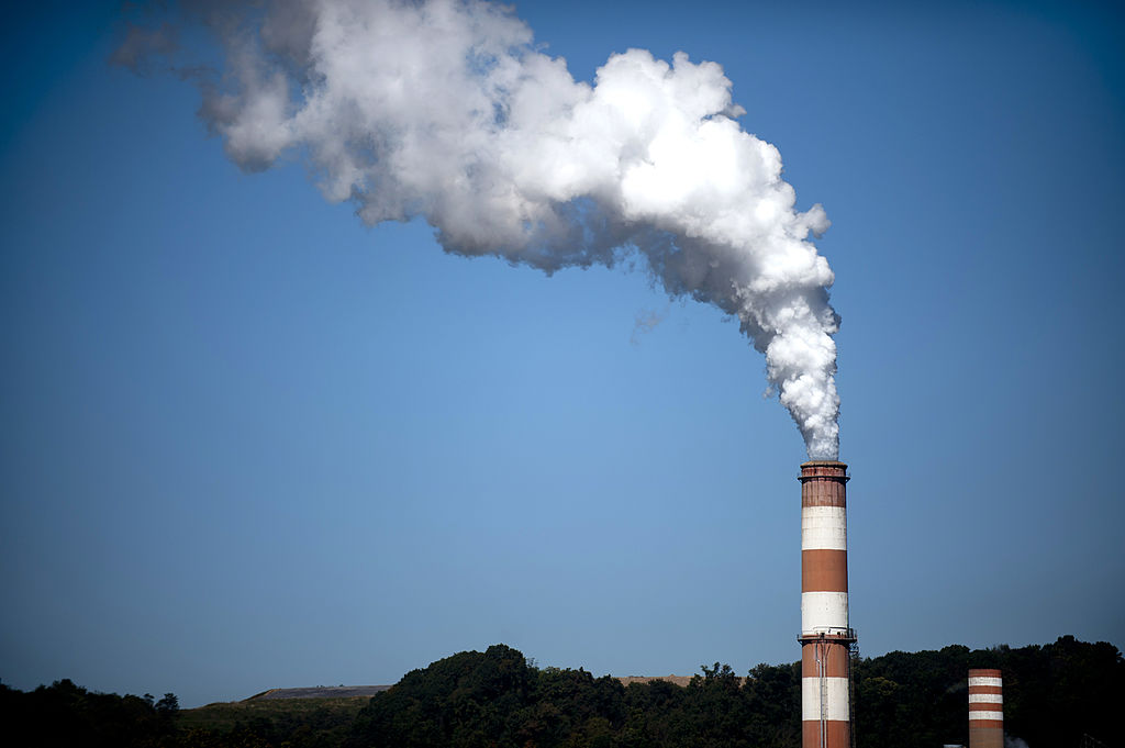 A plume of exhaust extends from the Mitchell Power Station, a coal-fired power plant built along the Monongahela River, 20 miles southwest of Pittsburgh. (Photo credit: Jeff Swensen/Getty Images)
