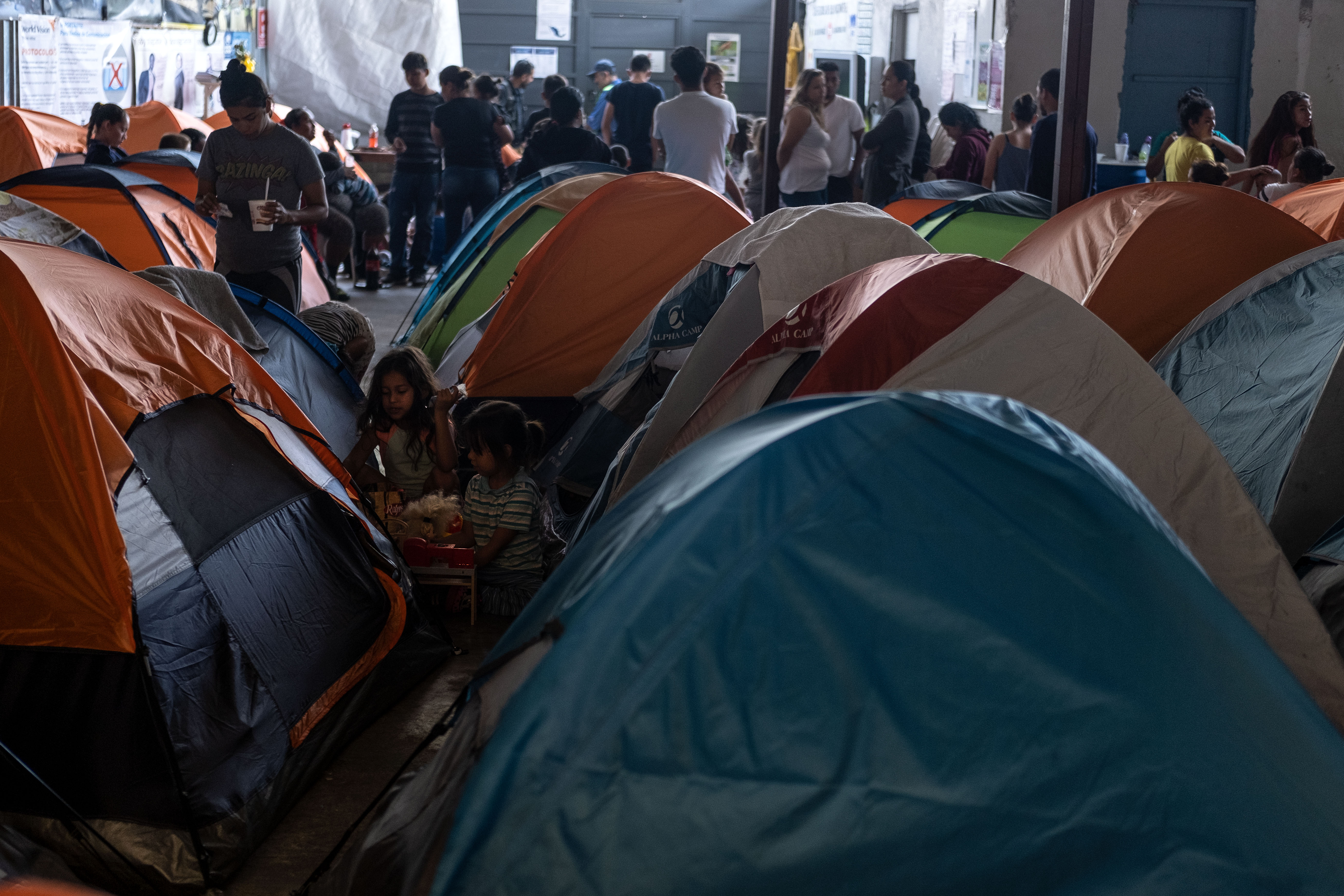 Migrants seeking for asylum in the United States are seen in Juventud 2000 migrant shelter in Tijuana, Baja California state, on June 19, 2019, Mexico ahead of World Refugees Day. (Credit: GUILLERMO ARIAS/AFP/Getty Images)