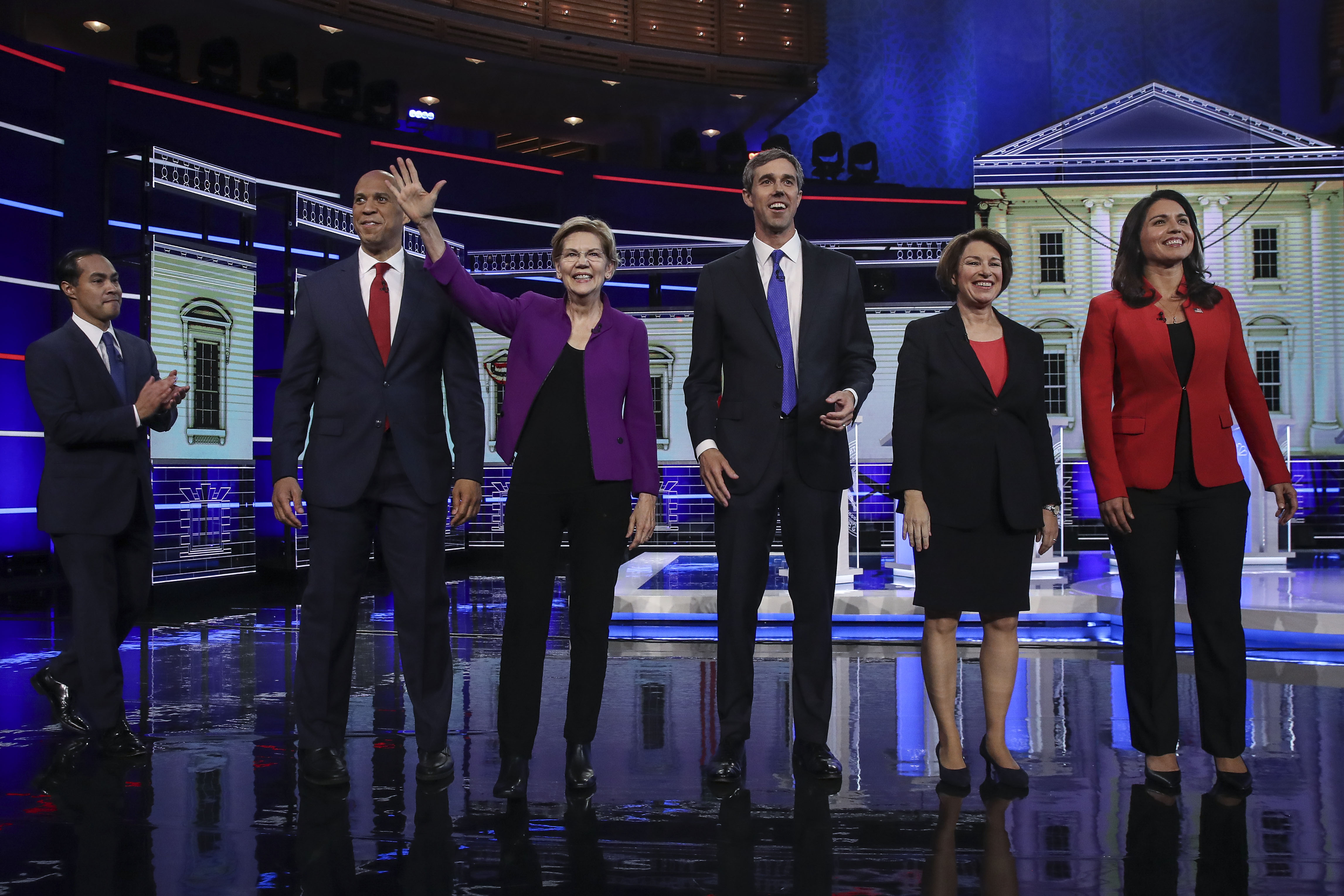 MIAMI, FL - JUNE 26: (L-R) Former housing secretary Julian Castro, Sen. Cory Booker (D-NJ), Sen. Elizabeth Warren (D-MA), former Texas congressman Beto O'Rourke, Sen. Amy Klobuchar (D-MN), and Rep. Tulsi Gabbard (D-HI) take the stage for the first Democratic presidential primary debate for the 2020 election at the Adrienne Arsht Center for the Performing Arts, June 26, 2019 in Miami, Florida. CREDIT: Drew Angerer/Getty Images