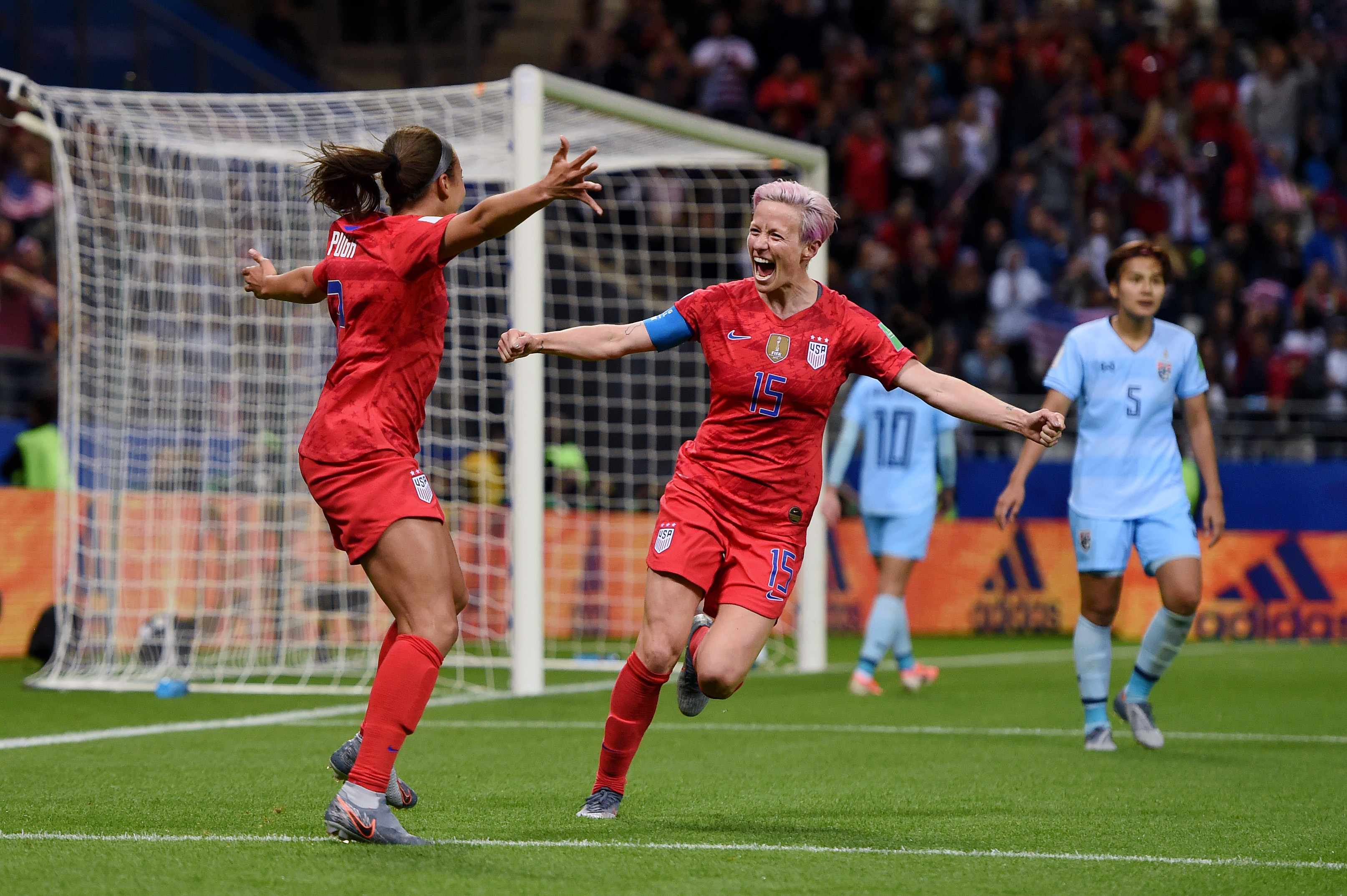 REIMS, FRANCE - JUNE 11: Mallory Pugh of the USA celebrates with teammate Megan Rapinoe after scoring her team's eleventh goal during the 2019 FIFA Women's World Cup France group F match between USA and Thailand at Stade Auguste Delaune on June 11, 2019 in Reims, France. (Photo by Alex Caparros - FIFA/FIFA via Getty Images)