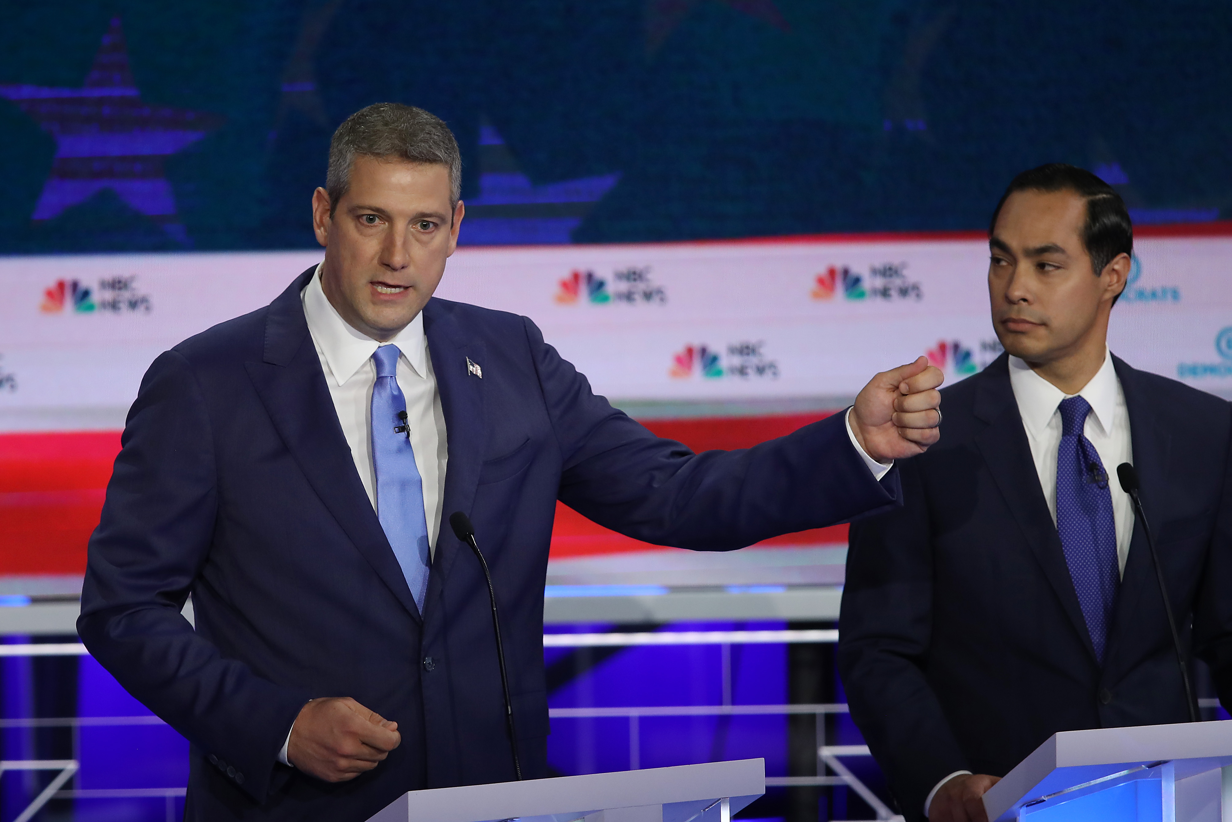 Rep. Tim Ryan (D-OH) speaks as former housing secretary Julian Castro looks on during the first night of the Democratic presidential debate on June 26, 2019 in Miami, Florida. Ryan claimed the Taliban "started flying planes into our buildings," and Rep. Tulsi Gabbard (D-HI) had to correct him and say Al Qaeda, not the Taliban, was responsible for the attacks on September 11, 2001. (Photo by Joe Raedle/Getty Images)