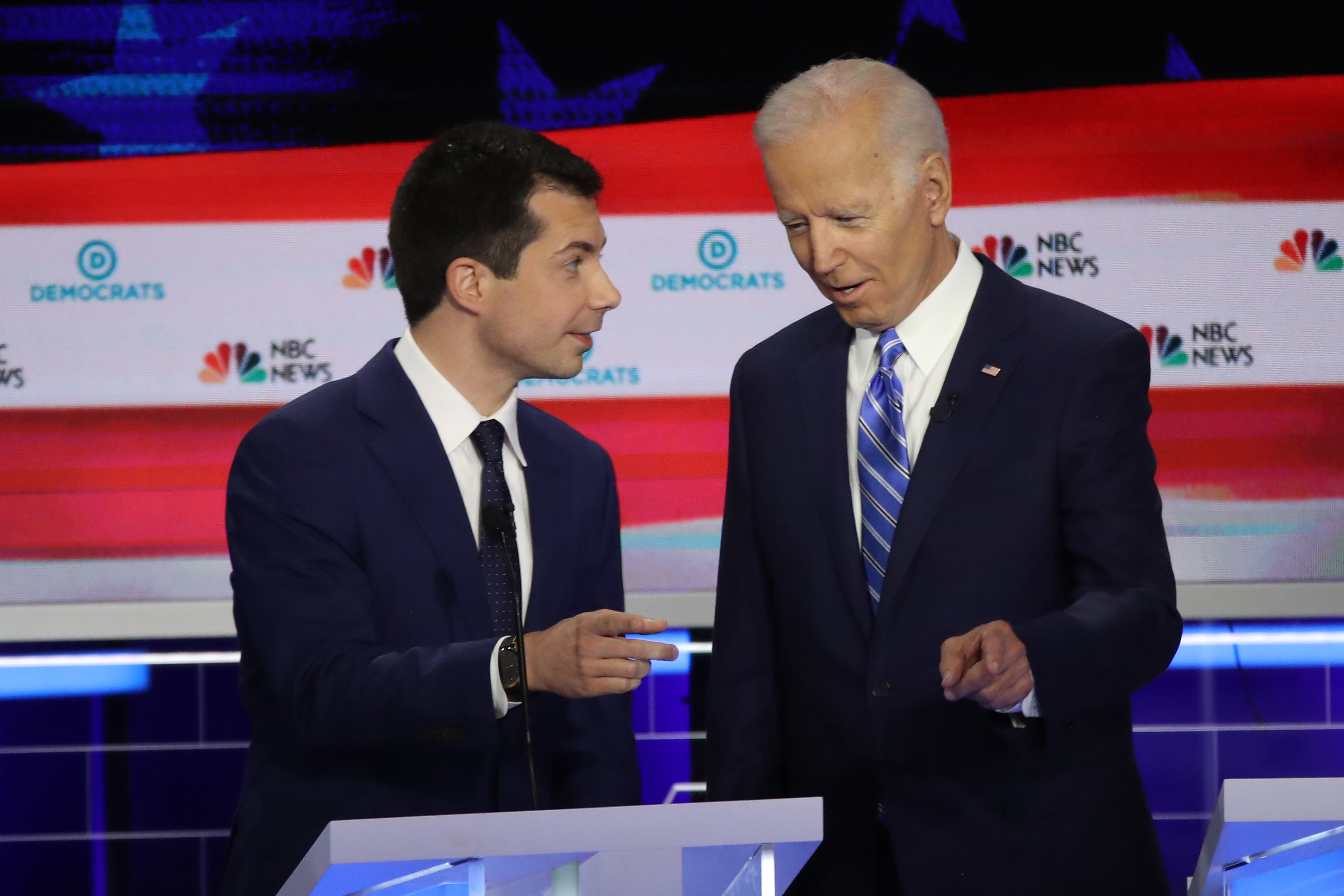 MIAMI, FLORIDA - JUNE 27: South Bend, Indiana Mayor Pete Buttigieg (L) and former Vice President Joe Biden talk during the second night of the first Democratic presidential debate on June 27, 2019 in Miami, Florida. Credit: Drew Angerer/Getty Images