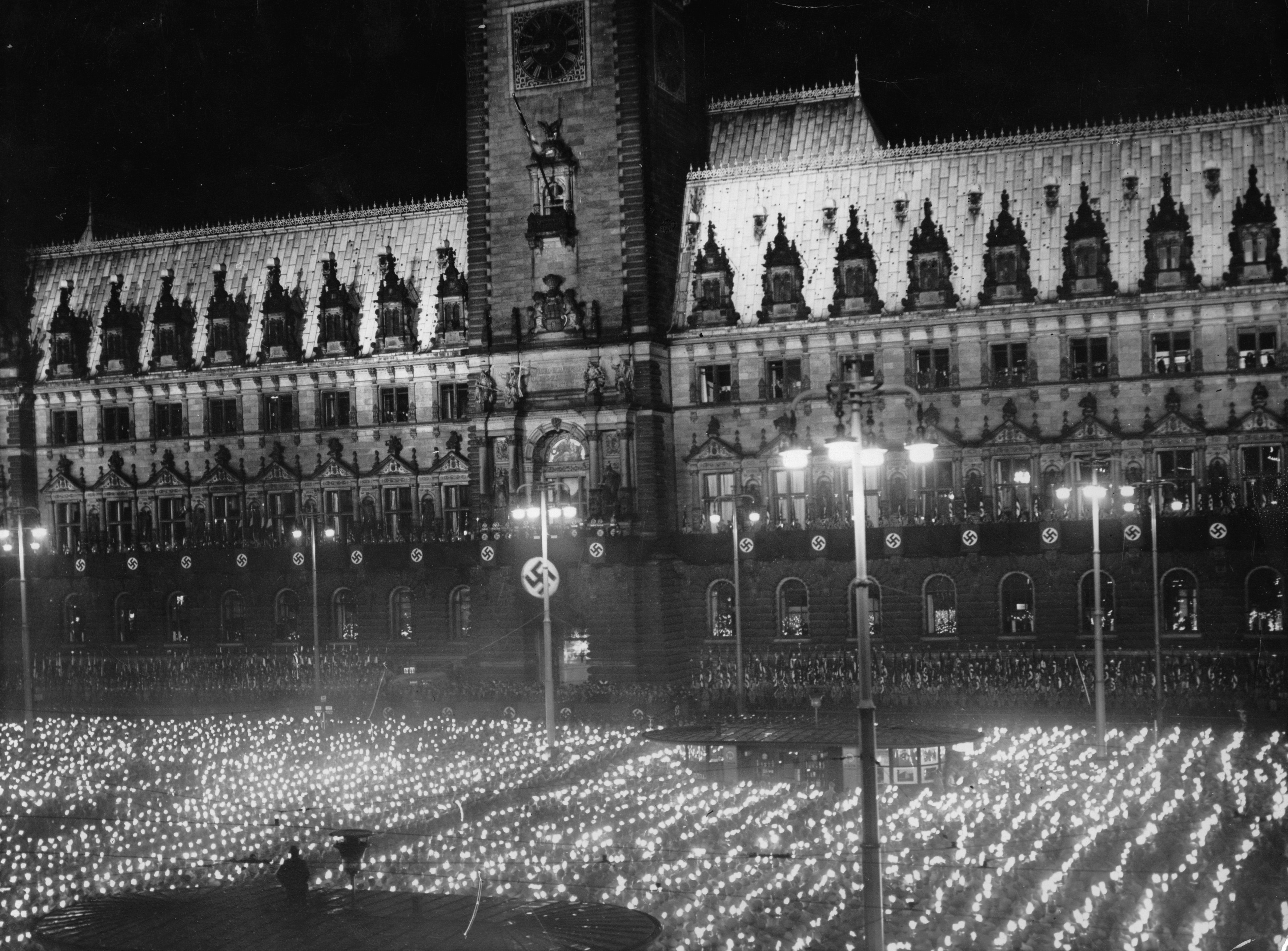GERMANY - CIRCA 1900: Rally at the Adolf-Hitler-Place in Hamburg on the occasion of the commencement of the Groß-Hamburg-act. In the background the guildhall. Germany. Photograph. April 1937. (Photo by Imagno/Getty Images)