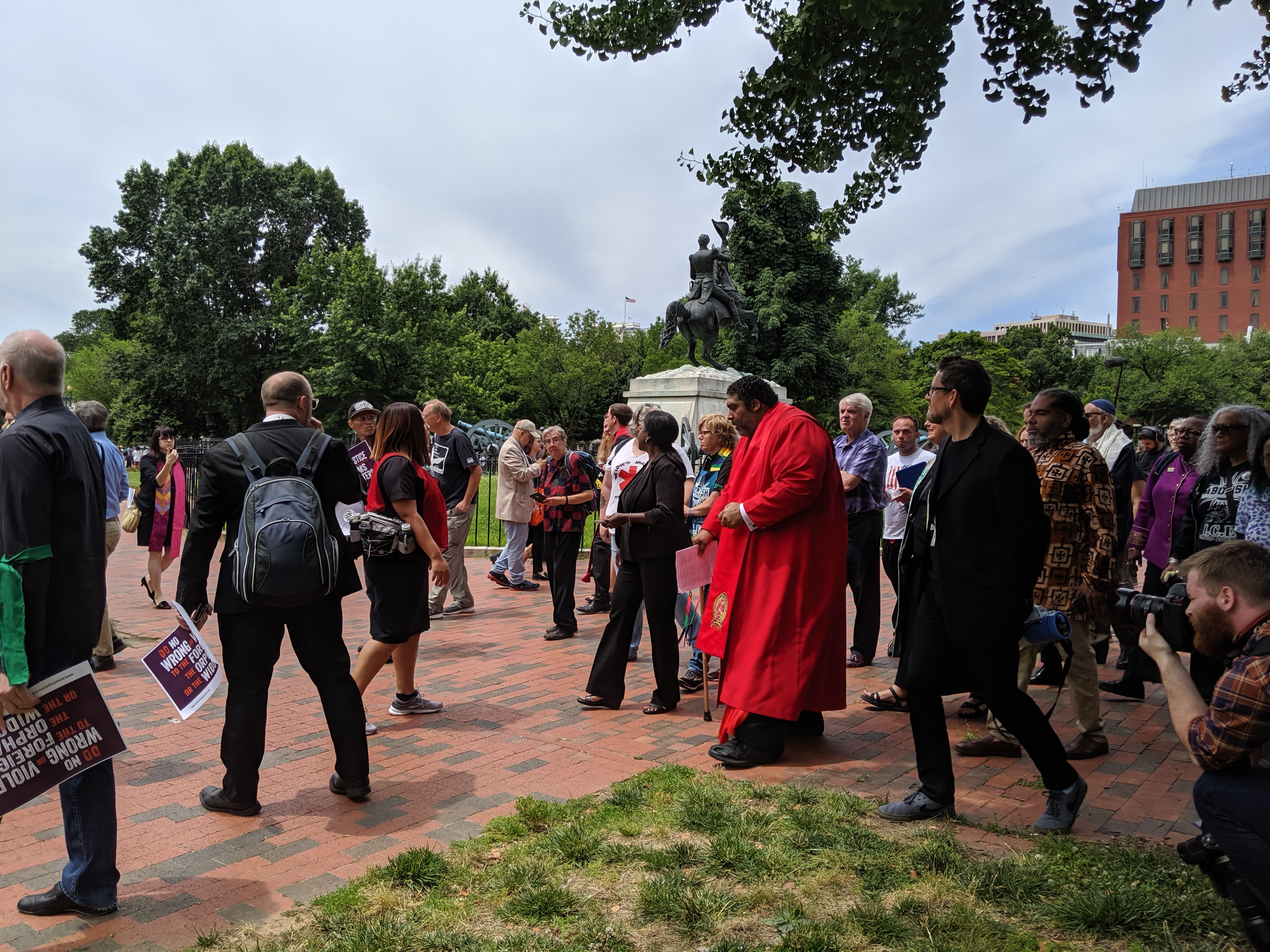 Rev. Dr. William Barber leads activists into Lafayette Park, after Secret Service had previously closed it off. Activists had gathered for Repairers of the Breach's "Moral Witness Wednesday," June 12, 2019, Washington, D.C. (Photo Credit: ThinkProgress/Adrienne Mahsa Varkiani)