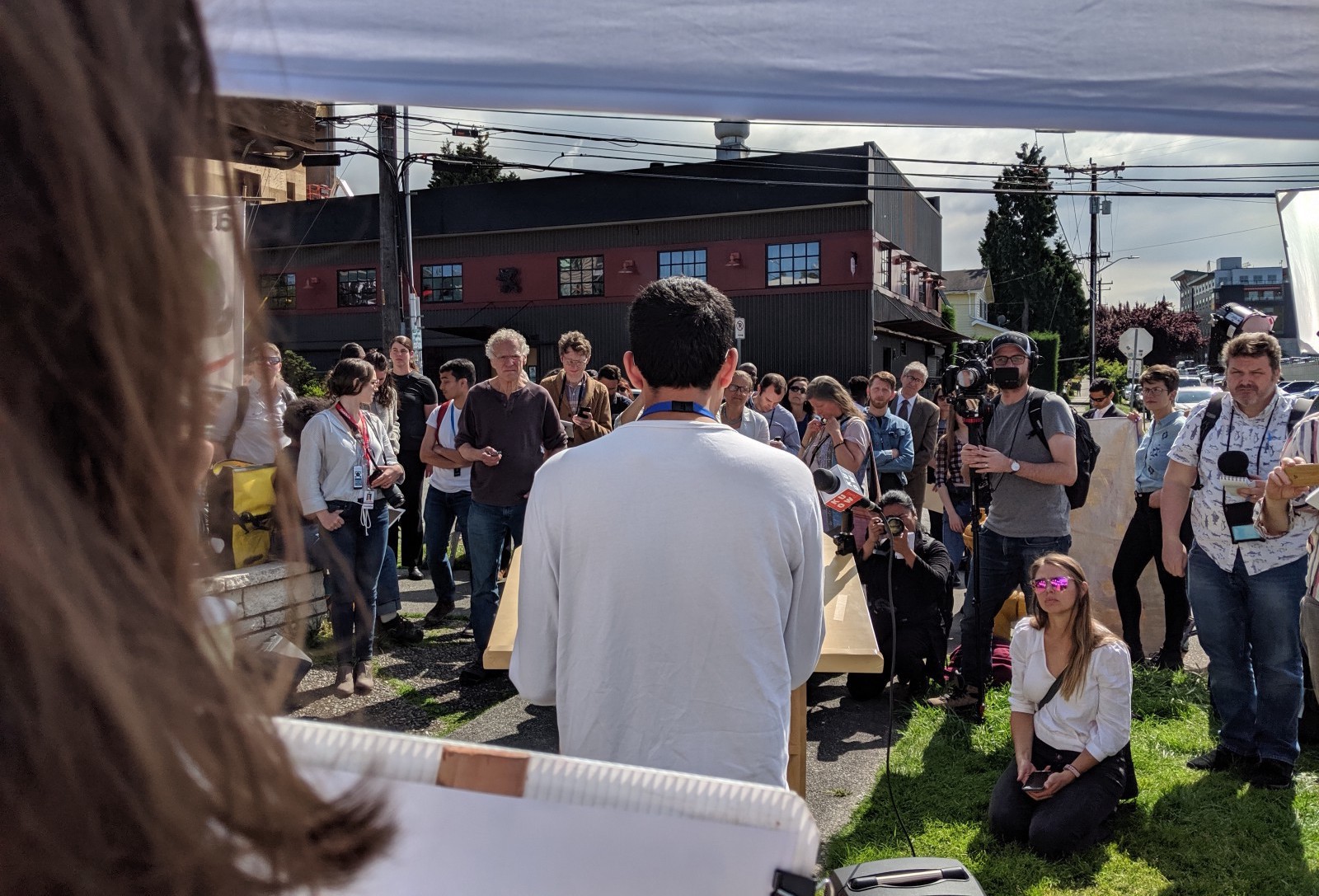Rajit Iftikhar addresses supporters and the press at an employee rally. CREDIT: Amazon Employees for Climate Justice