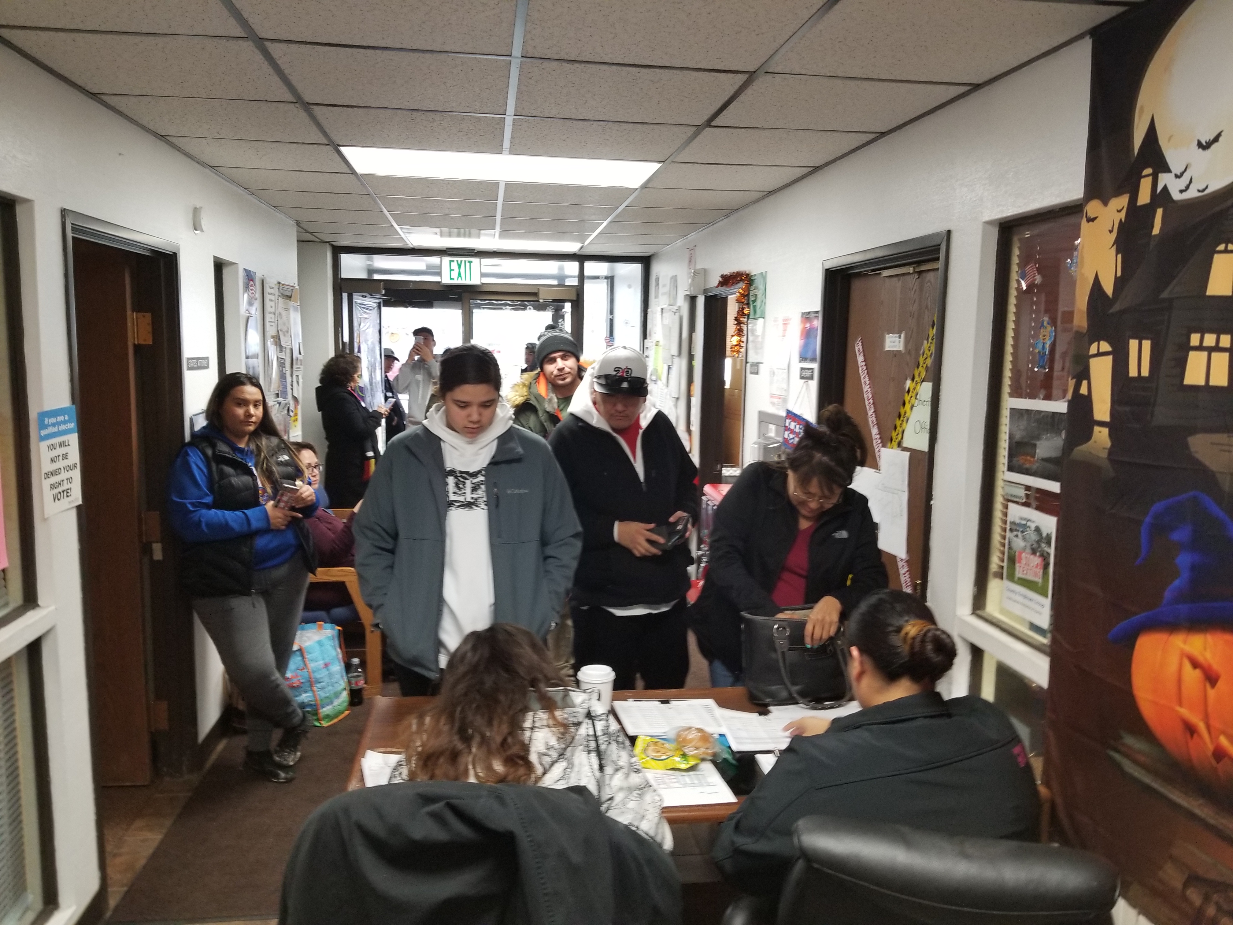 People stand in line to vote at the Fort Yates polling location on the Standing Rock Sioux reservation in North Dakota during the November 6, 2018 midterm elections. PHOTO CREDIT: Danielle McLean for ThinkProgress