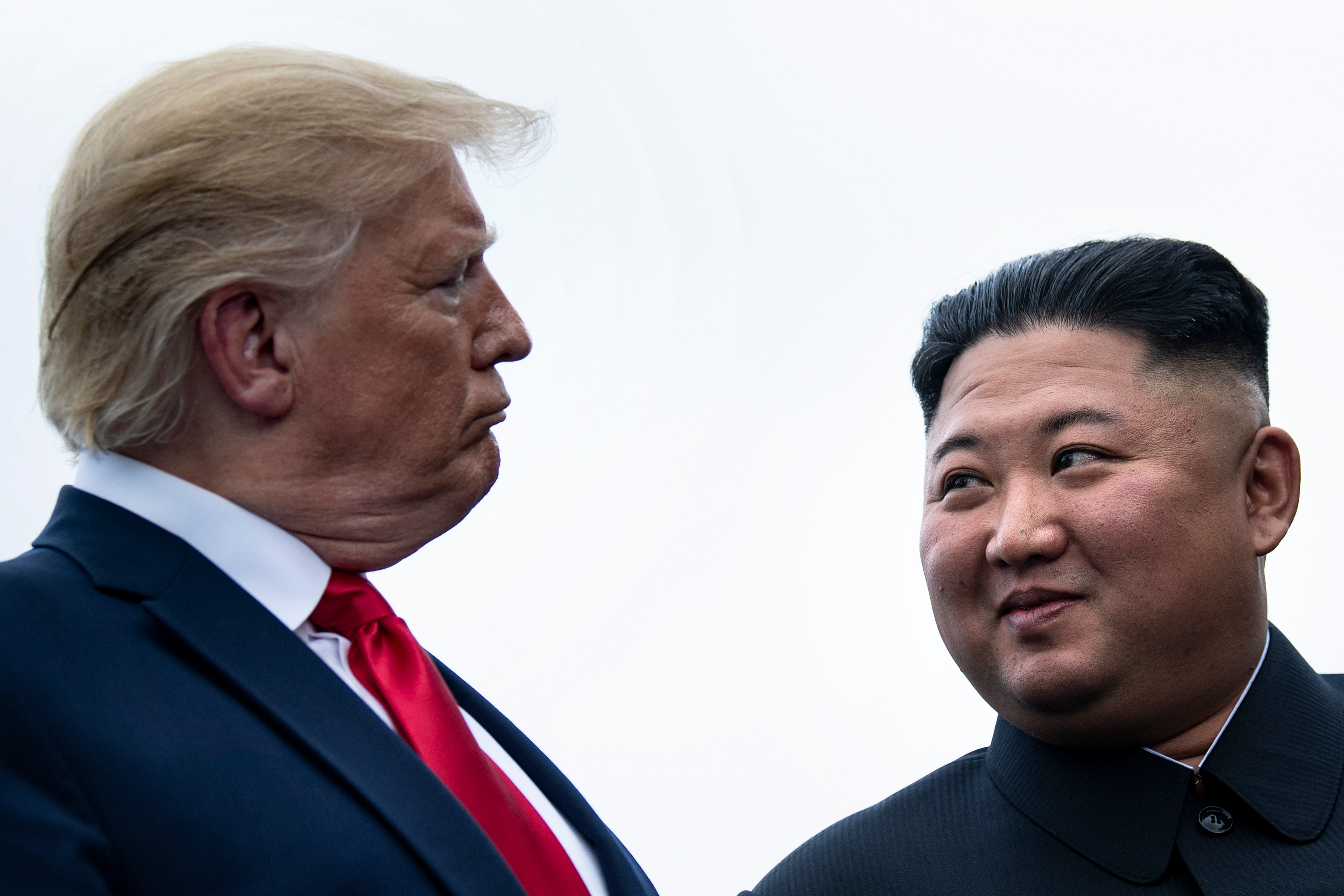 President Donald Trump and North Korea's leader Kim Jong-un talk before a meeting in the Demilitarized Zone(DMZ) on June 30, 2019, in Panmunjom, Korea. CREDIT: Brendan Smialowski/AFP) Getty Images.