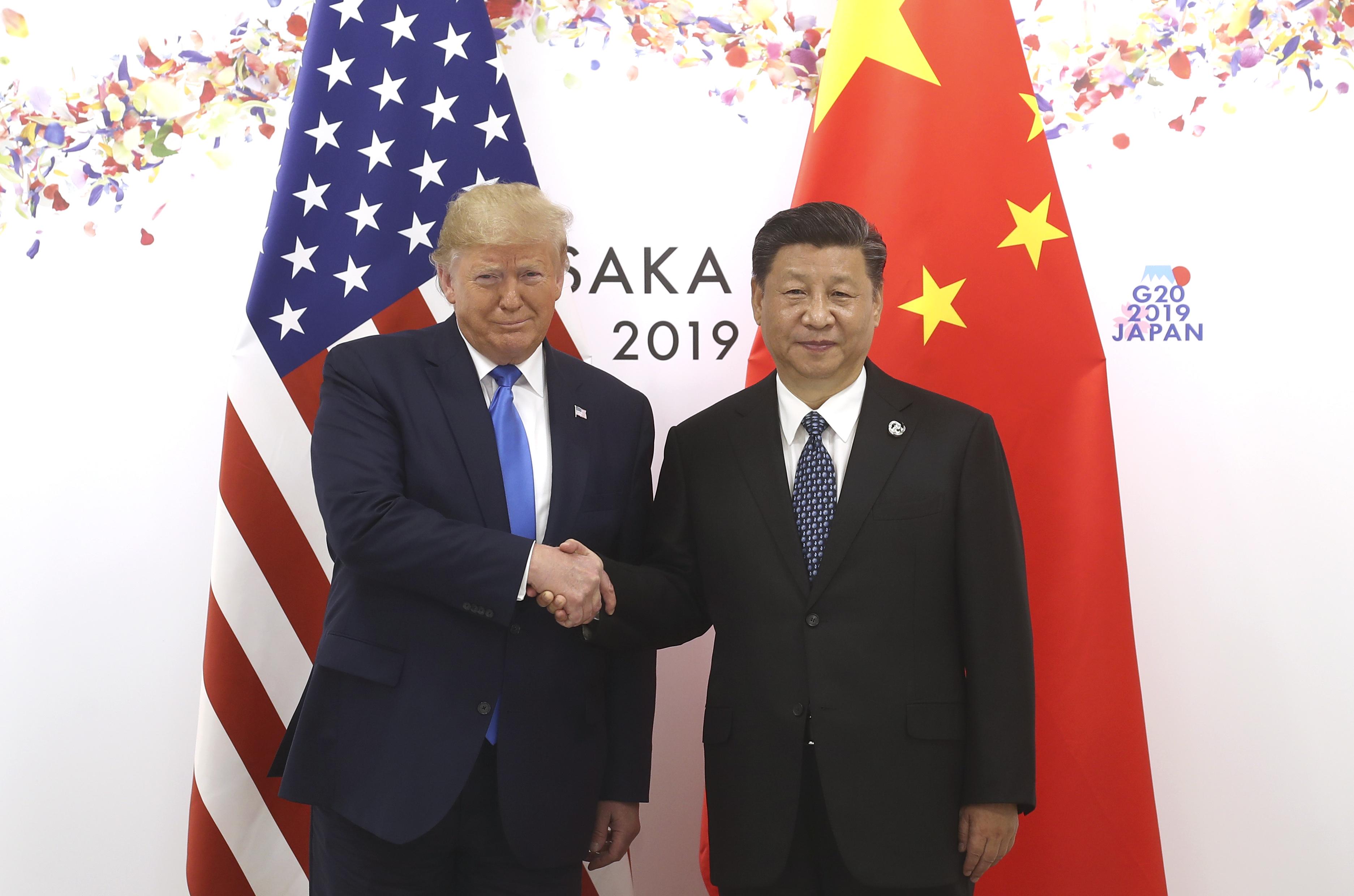 President Xi Jinping shakes hands with President Donald Trump before a bilateral meeting during the G20 Summit on June 29, 2019 in Osaka, Japan. CREDIT: Sheng Jiapeng/China News Service/VCG/Getty Images/