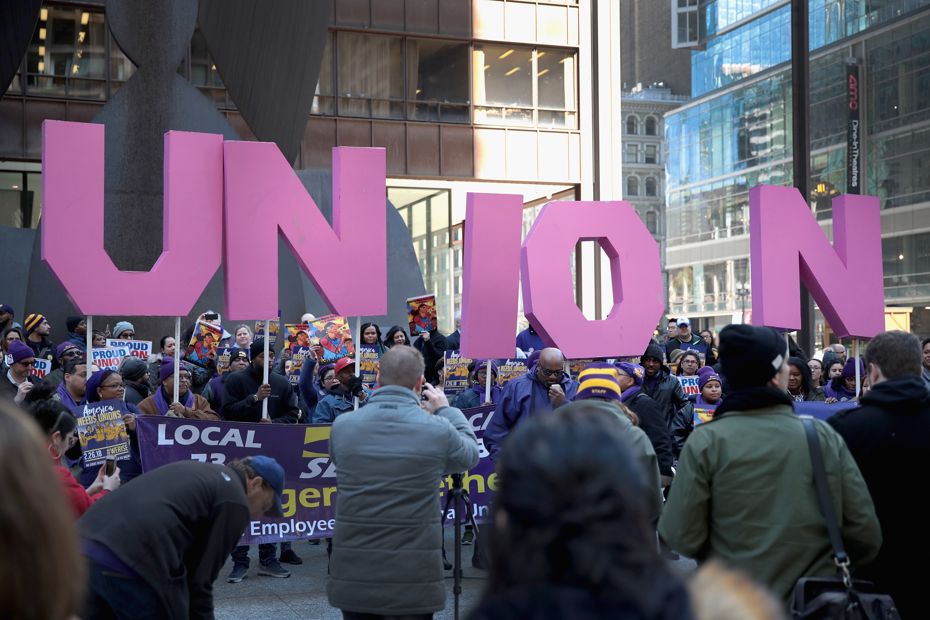 CHICAGO, IL - FEBRUARY 26: Members of the Service Employees International Union (SEIU) hold a rally in support of the American Federation of State County and Municipal Employees (AFSCME) union at the Richard J. Daley Center plaza on February 26, 2018 in Chicago, Illinois. Today the U.S. Supreme Court is hearing arguments in Janus v. AFSCME, a lawsuit that challenges unions' authority under state law to collect compulsory fees from all employees they serve. (Photo by Scott Olson/Getty Images)