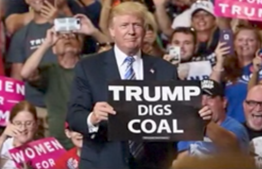 Donald Trump holds a sign at a rally in Huntington, WV. CREDIT: Donald J. Trump/Facebook
