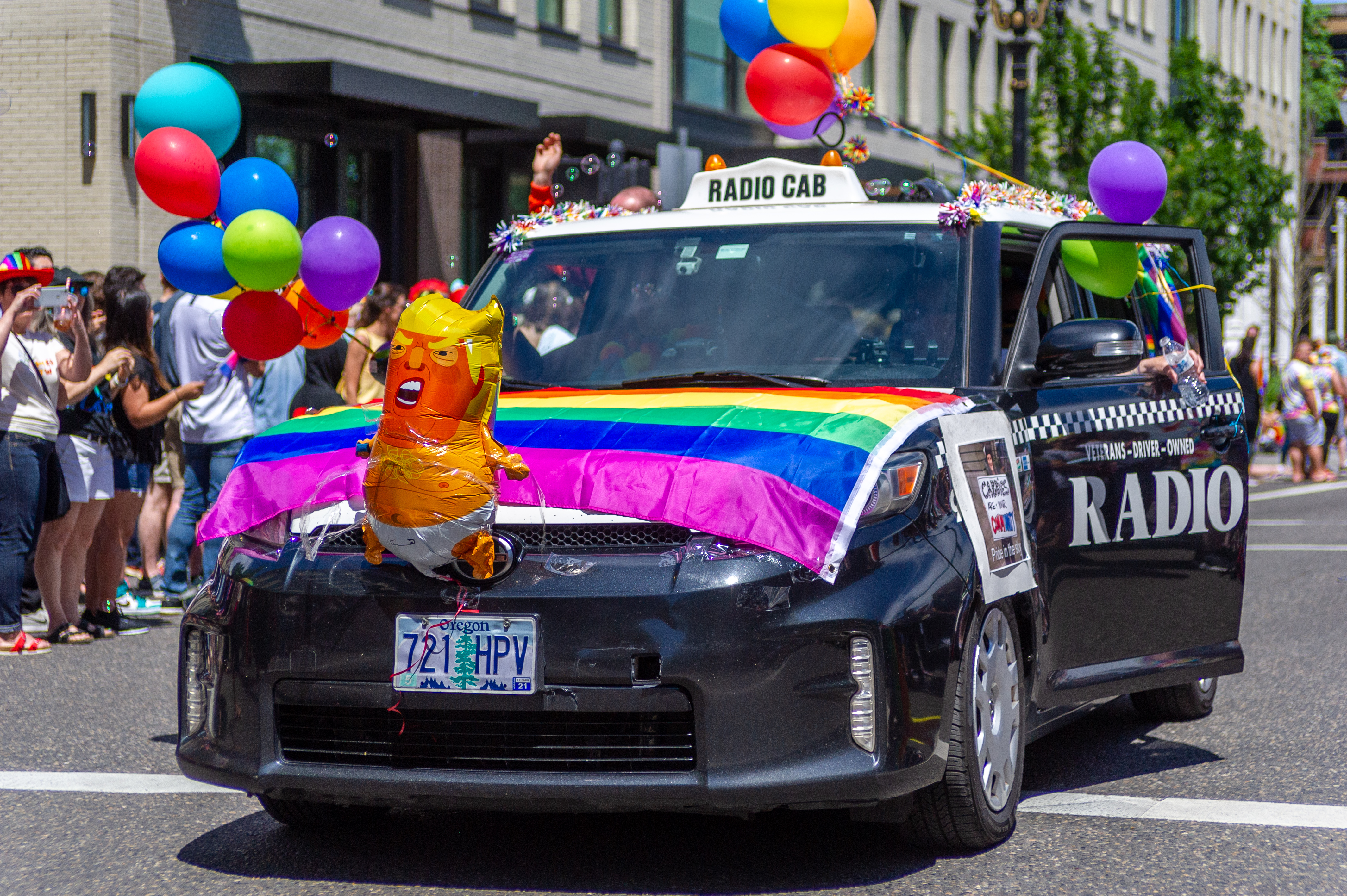 PORTLAND, OR - JUNE 16: A car from the popular Portland cab service Radio Cab displays a rainbow flag and a tiny version of the famous President Donald Trump balloon during the Portland Pride Parade and Festival on June 16, 2019, in Portland, OR. (Photo by Diego Diaz/Icon Sportswire via Getty Images)