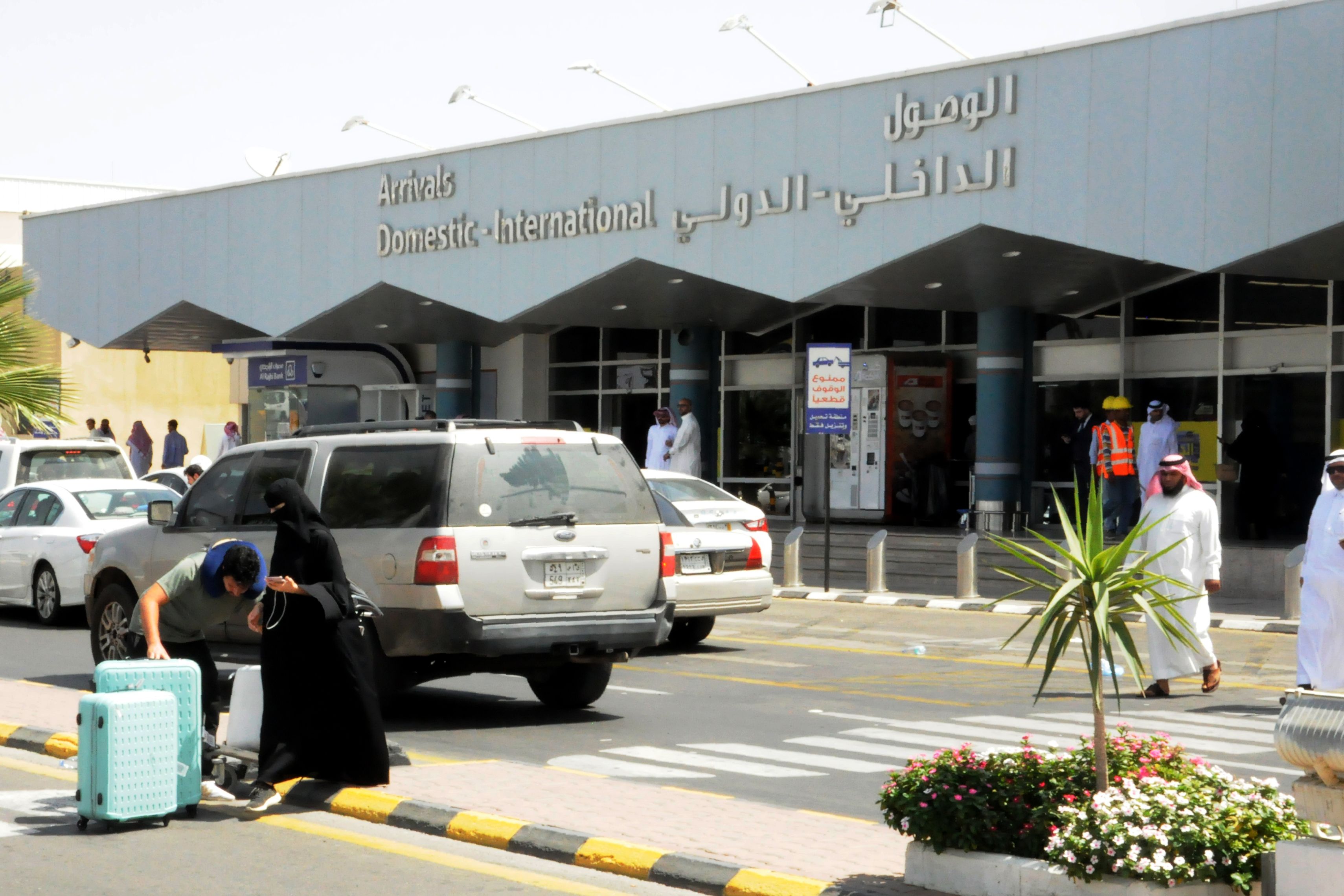 Travellers gather in front of the arrivals lounge at the Abha airport in the southern Saudi Arabian popular mountain resort of the same name, on July 2, 2019. CREDIT: AFP/Getty Images.