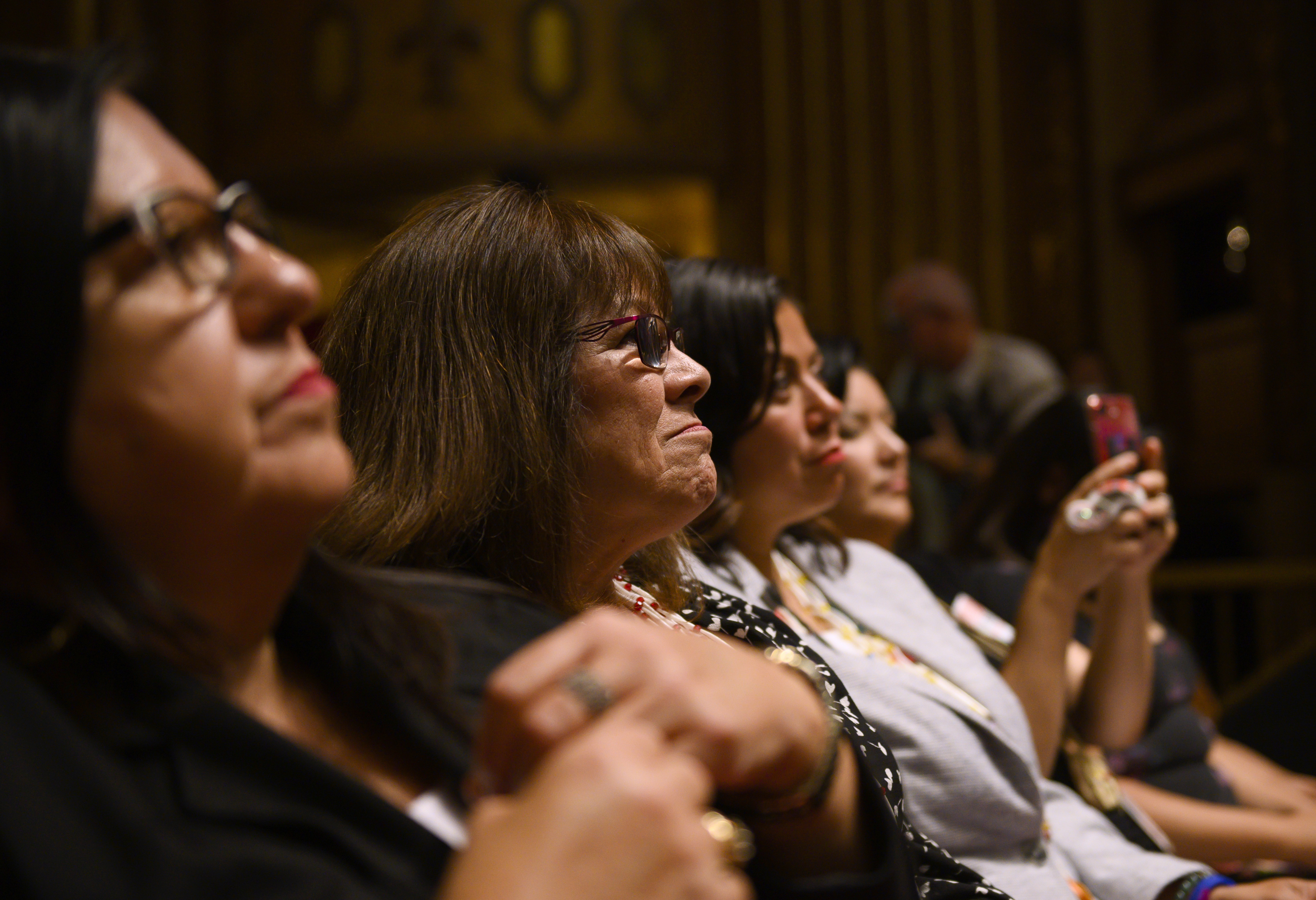 SIOUX CITY, IA - AUGUST 19: Audience members listen as Democratic presidential candidate Sen. Elizabeth Warren (D-MA) speaks at the Frank LaMere Native American Presidential Forum on August 19, 2019 in Sioux City, Iowa. CREDIT: Stephen Maturen/Getty Images