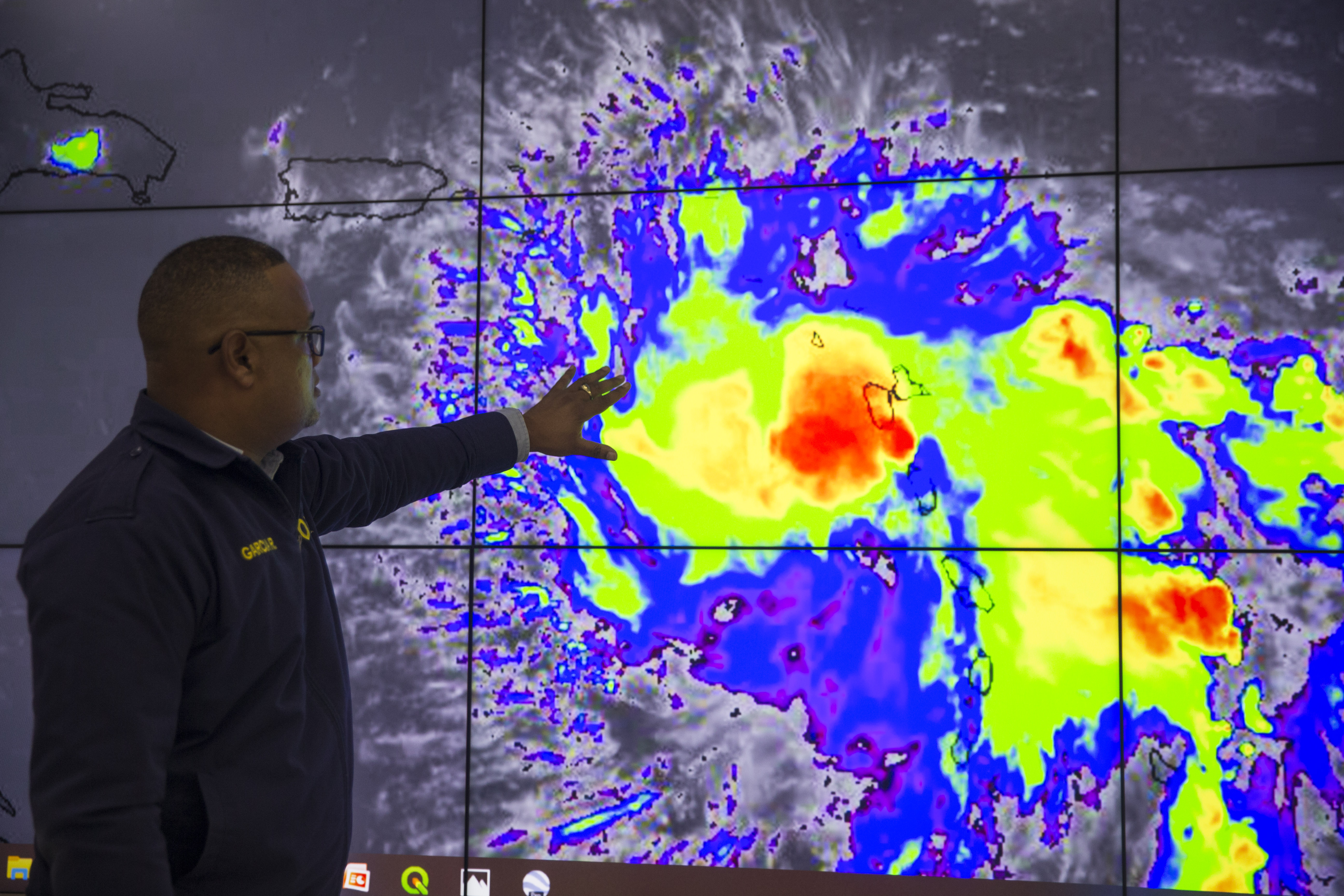 Workers of the Emergency Operation Centre (COE) monitor Tropical Storm Dorian in Santo Domingo, Dominican Republic, on August 27, 2019. CREDIT: ERIKA SANTELICES/AFP/Getty Images