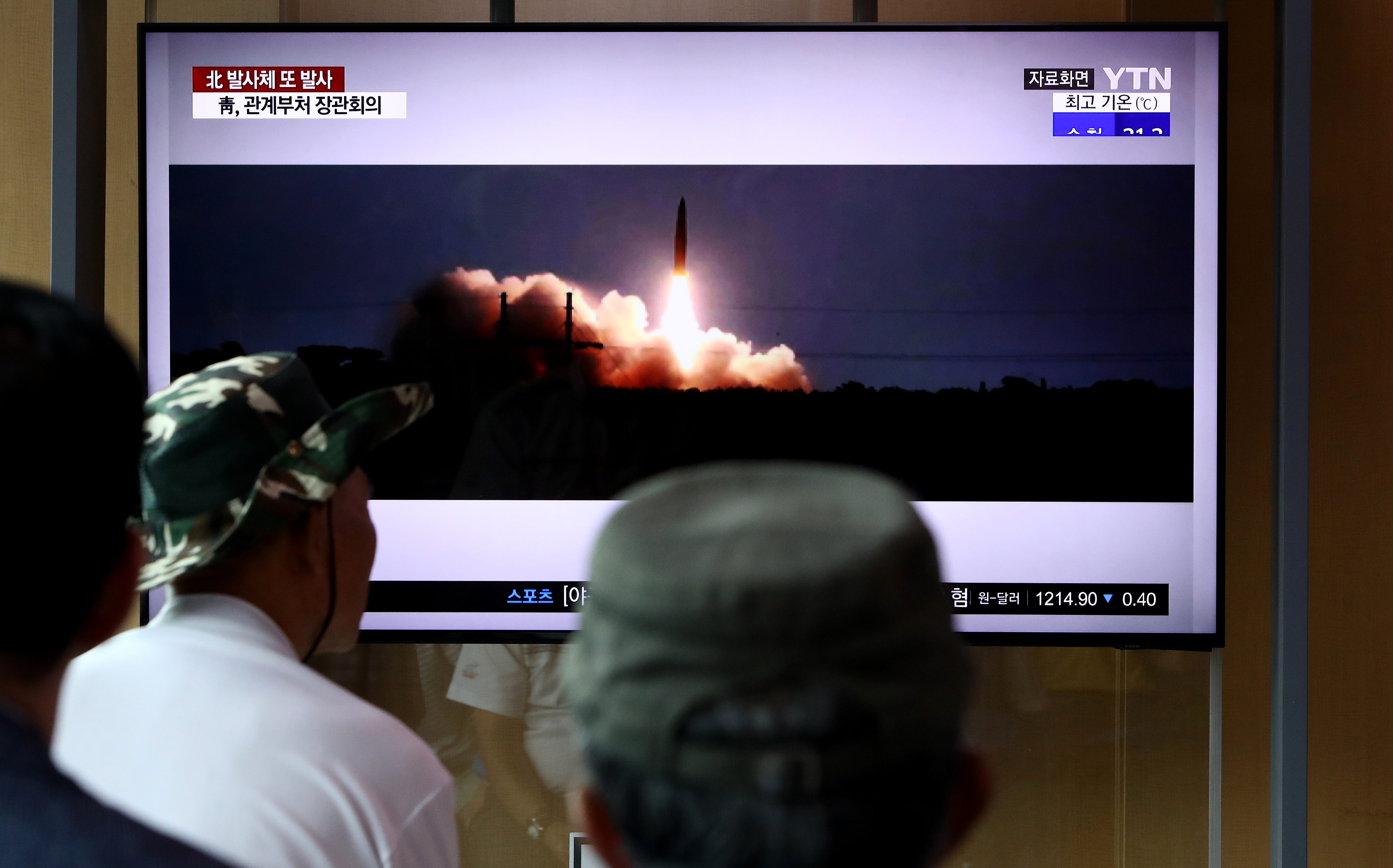 People watch a TV showing a file image of a North Korea's missile launch at the Seoul Railway Station on August 06, 2019 in Seoul, South Korea. CREDIT: Chung Sung-Jun/Getty Images.
