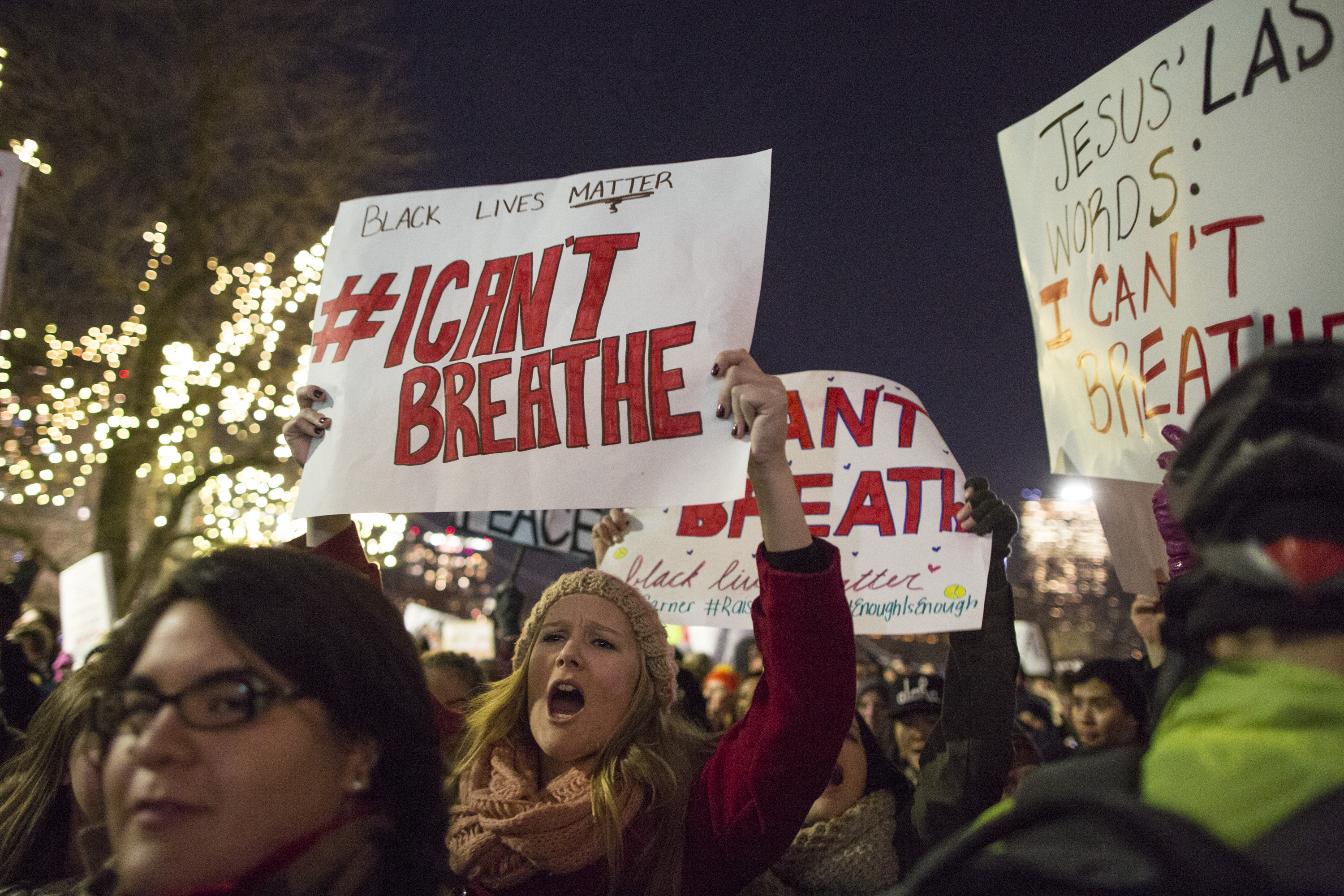 Protesters marched in Boston while chanting and holding signs during a 2014 protest against the decision by a Staten Island grand jury not to indict Officer Daniel Pantaleo, who used a banned chokehold in the death of Eric Garner. After five years of outrage and protests, Pantaleo was fired Monday by the New York City Police Department. (Photo by Scott Eisen/Getty Images)