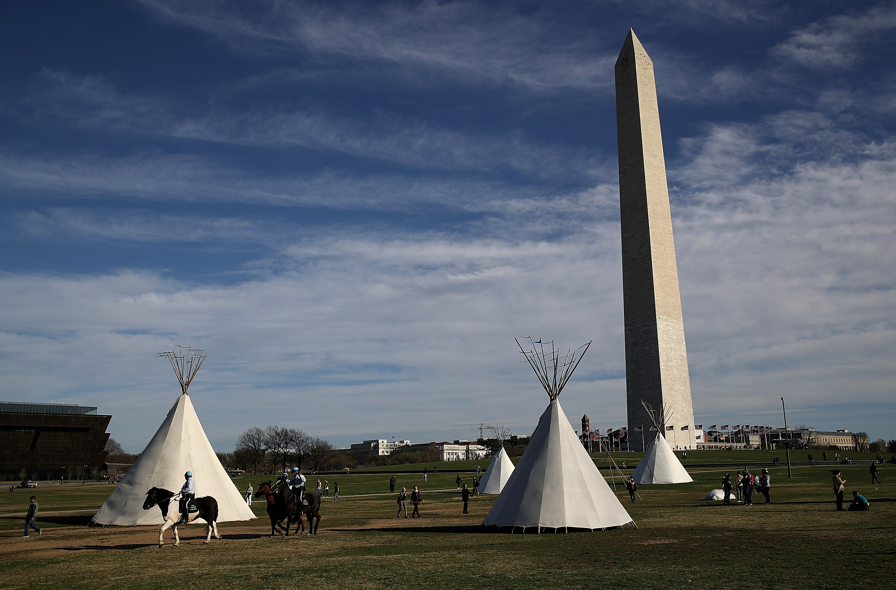 Tepees set up by Dakota Access Pipeline protesters stand next to the Washington Monument on March 8, 2017 in Washington, DC. CREDIT: Justin Sullivan/Getty Images