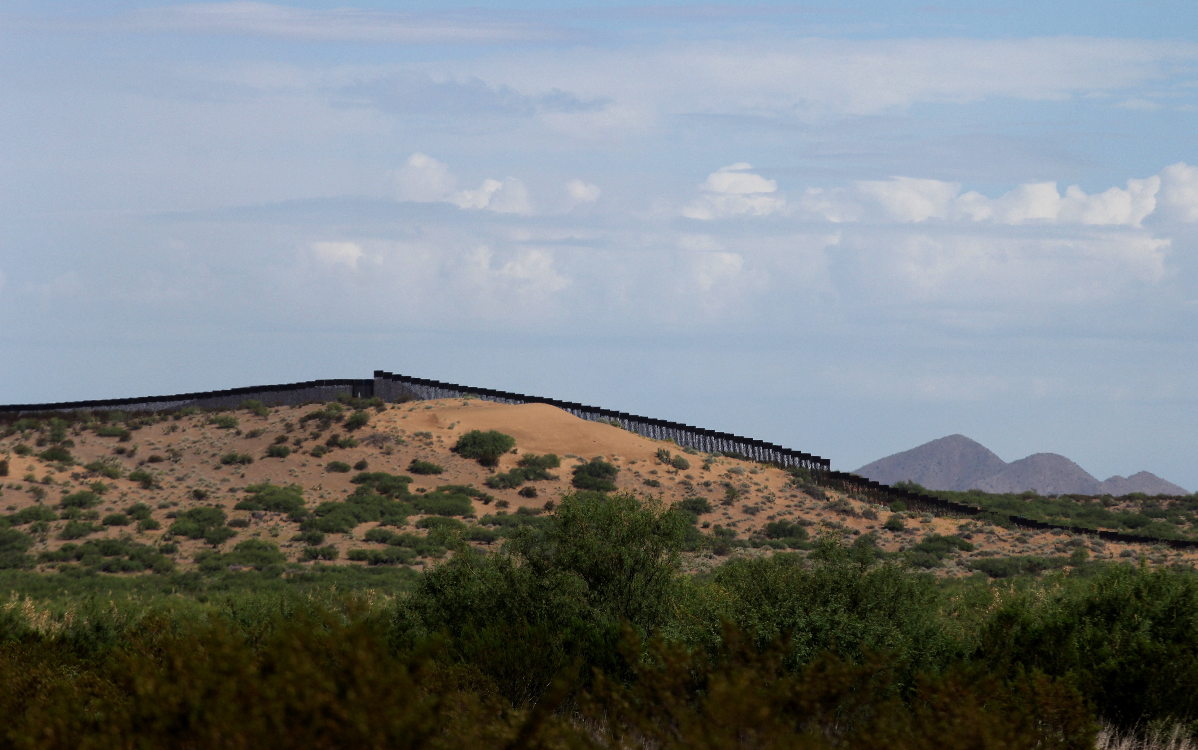 TOPSHOT - This picture taken on August 28, 2019 shows a portion of the wall on the US-Mexico border seen from Chihuahua State in Mexico, some 100 km from the city of Ciudad Juarez. - The US Defence Department said on September 3 it was freeing up $3.6 billion in funds budgeted for other projects to build a wall on the Mexican border as ordered by President Donald Trump. Six weeks after being confirmed by Congress, Defence Secretary Mike Esper has signed off on the diversion of funds, said Pentagon spokesman Jonathan Hoffmann. (Photo by HERIKA MARTINEZ / AFP) (Photo credit should read HERIKA MARTINEZ/AFP/Getty Images)